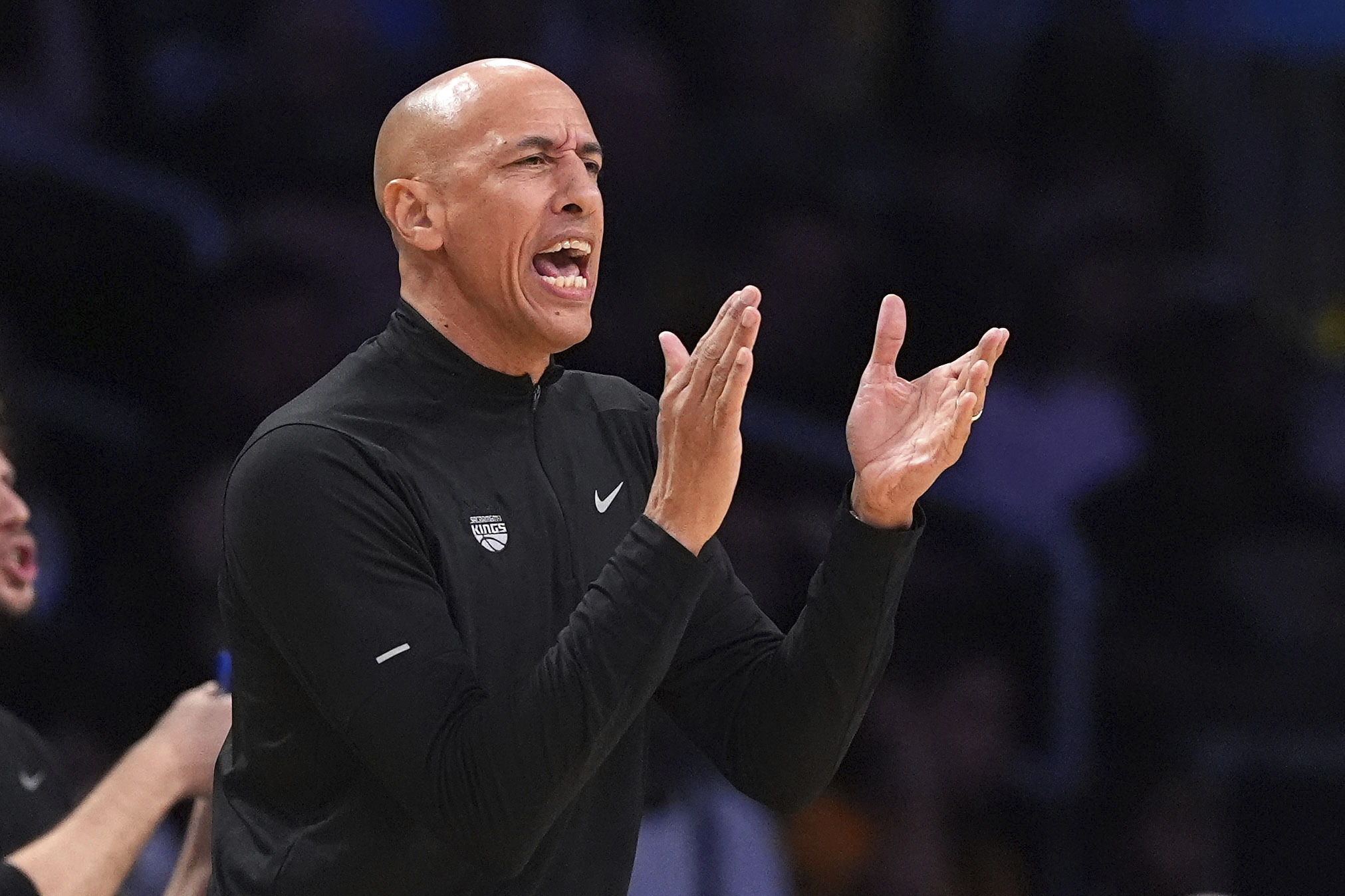 Sacramento Kings interim head coach Doug Christie claps during the...