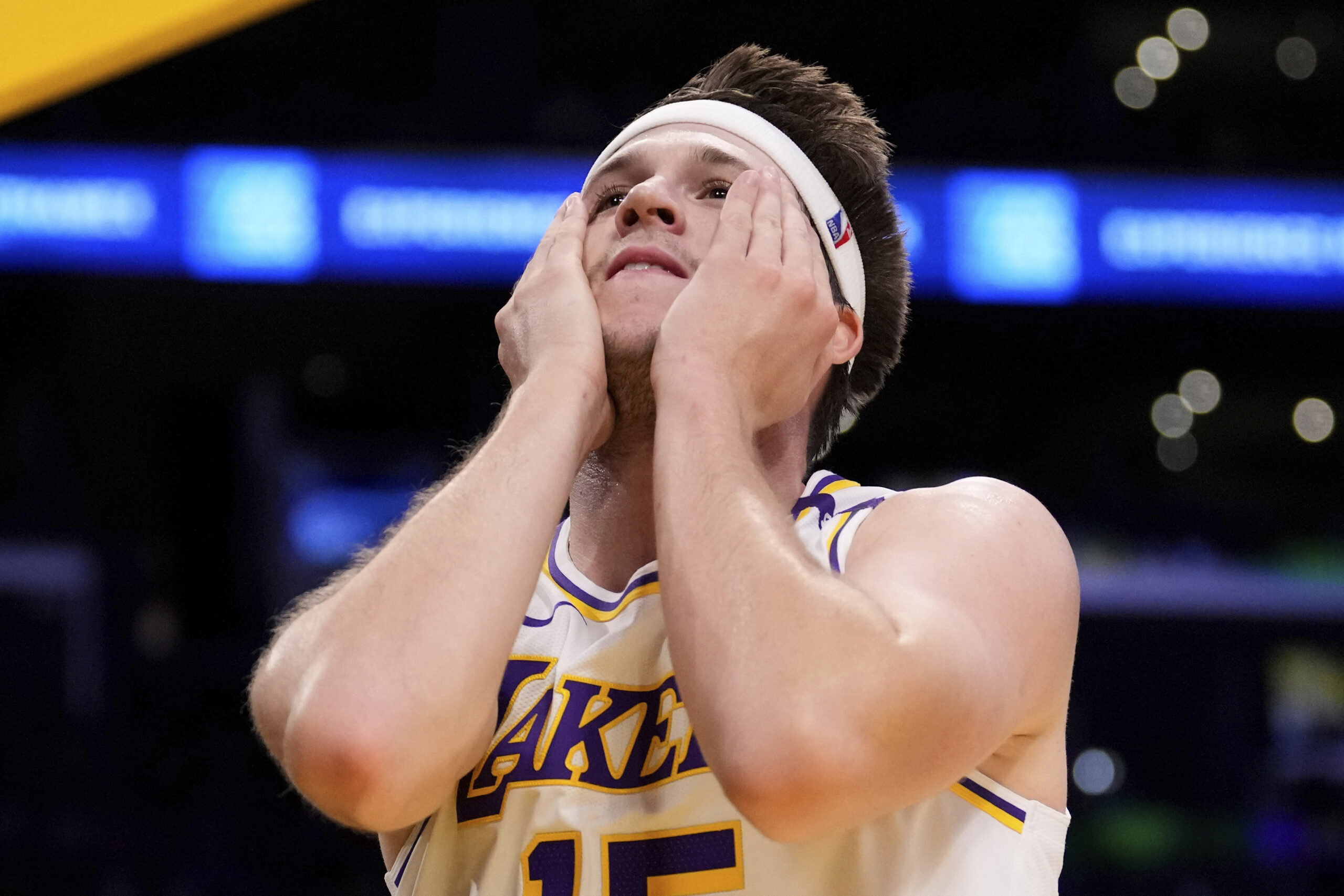 Lakers guard Austin Reaves reacts after getting fouled while shooting...