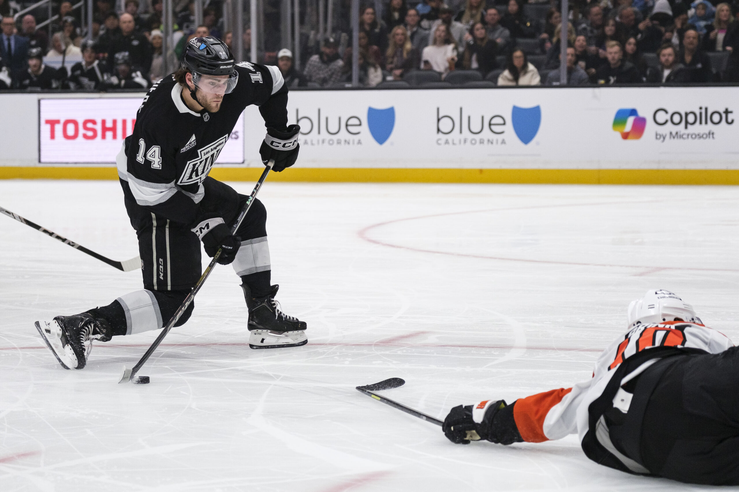 Kings right wing Alex Laferriere (14) looks to shoot the...