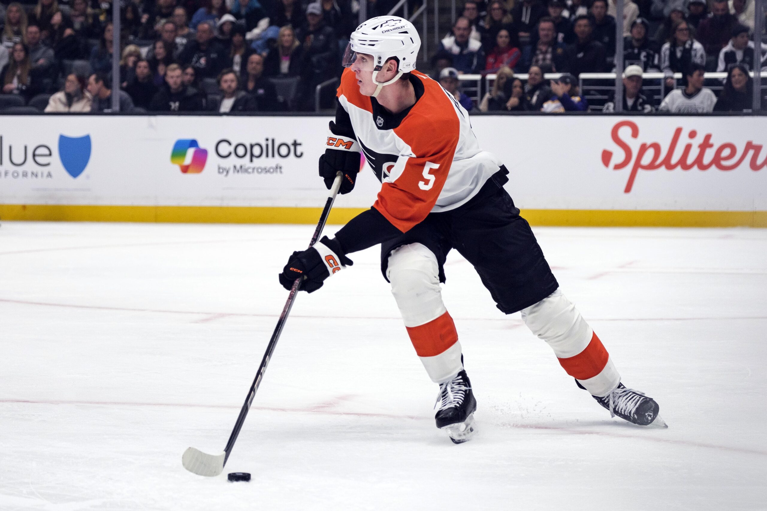 Philadelphia Flyers defenseman Egor Zamula controls the puck during the...