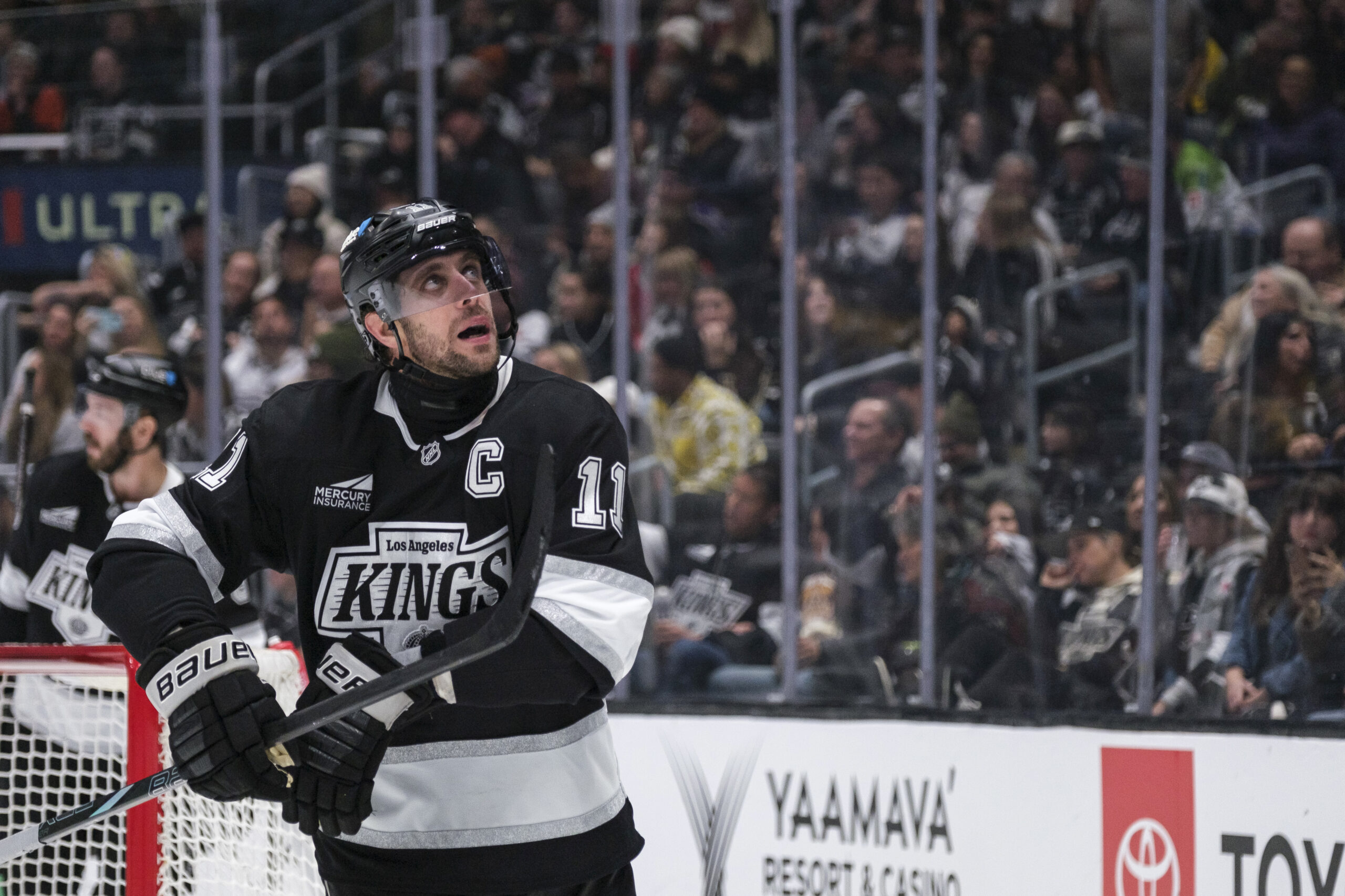 Kings center Anze Kopitar (11) looks up at the scoreboard...