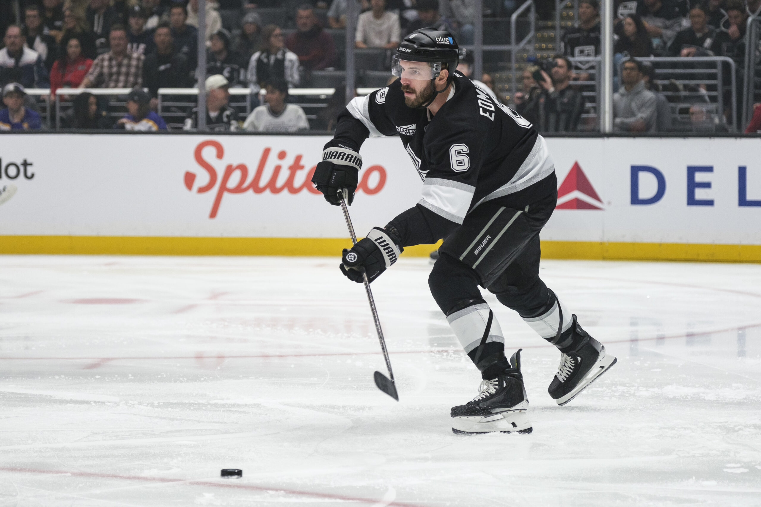 Kings defenseman Joel Edmundson (6) passes the puck during the...