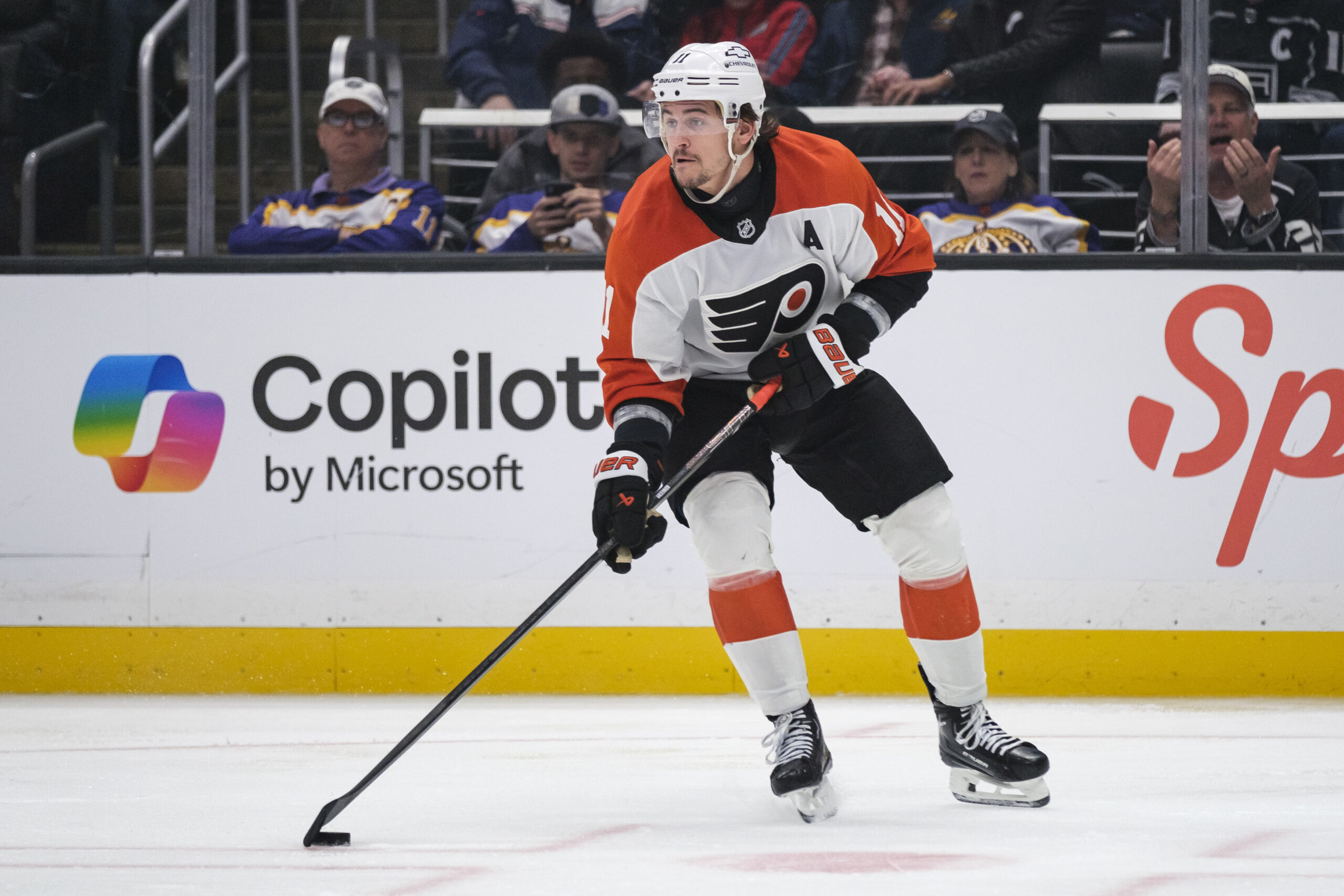 Philadelphia Flyers right wing Travis Konecny (11) looks to pass...