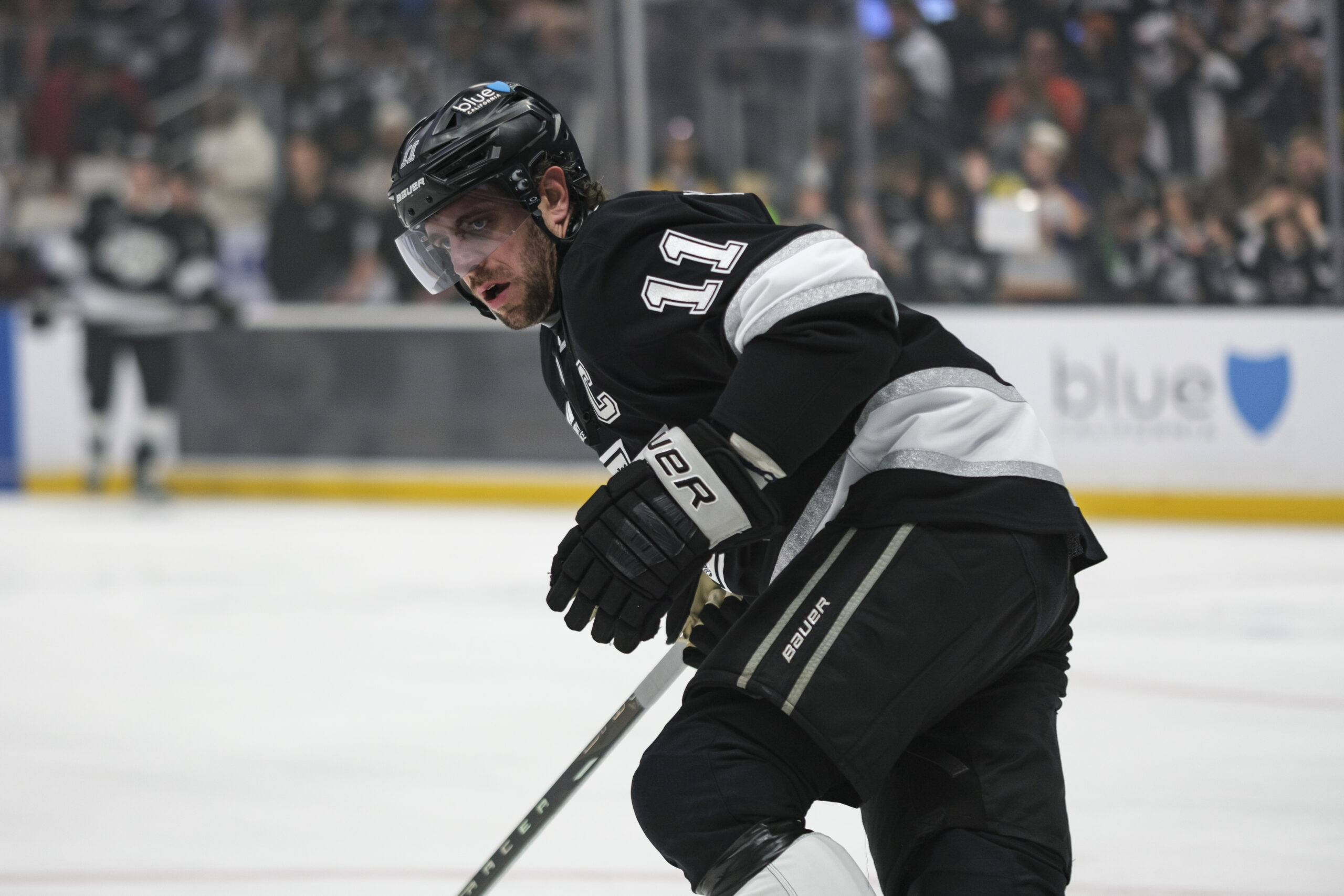 Kings center Anze Kopitar (11) skates during warmups before an...