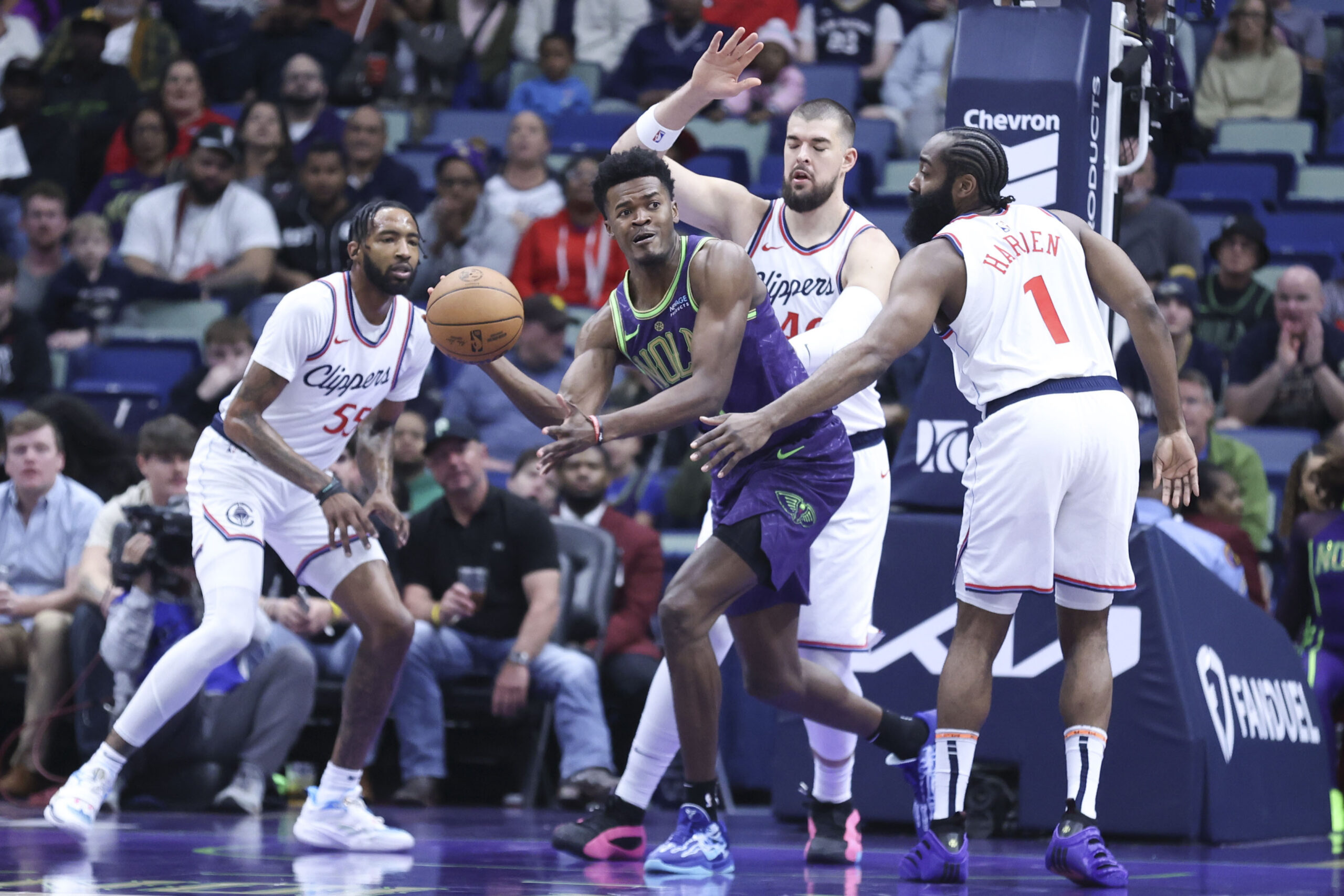 New Orleans Pelicans center Yves Missi passes the ball to...