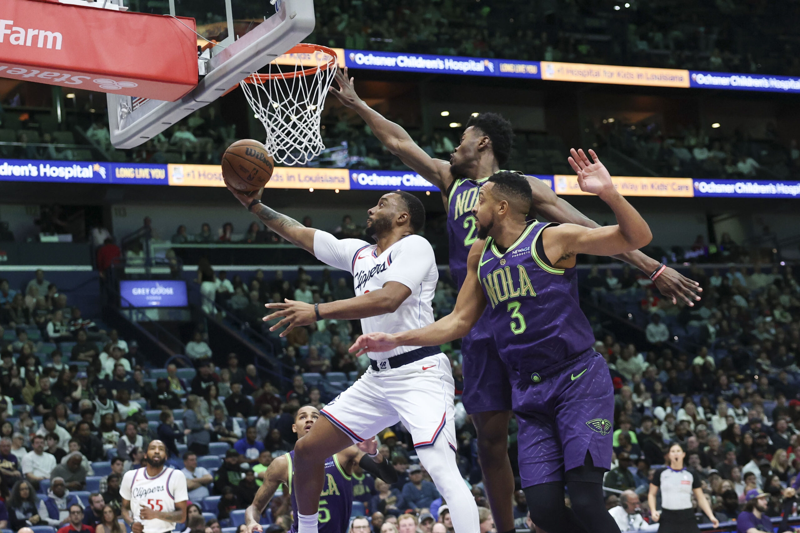 Clippers guard Norman Powell attempts a layup in front of...