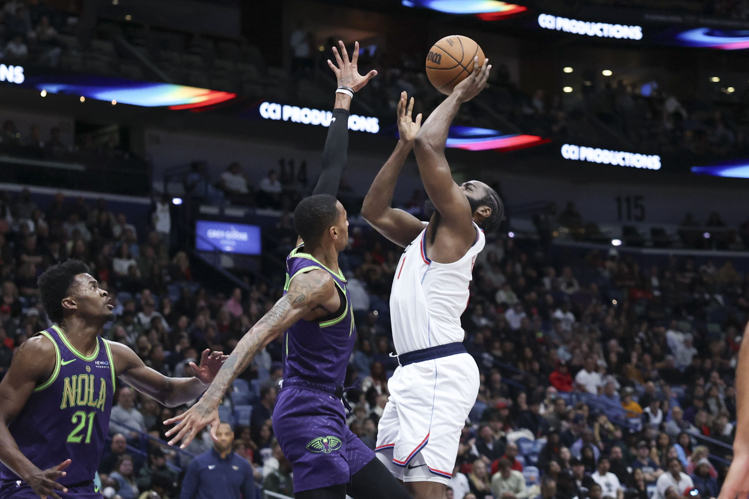 Clippers guard James Harden shoots a layup against New Orleans...