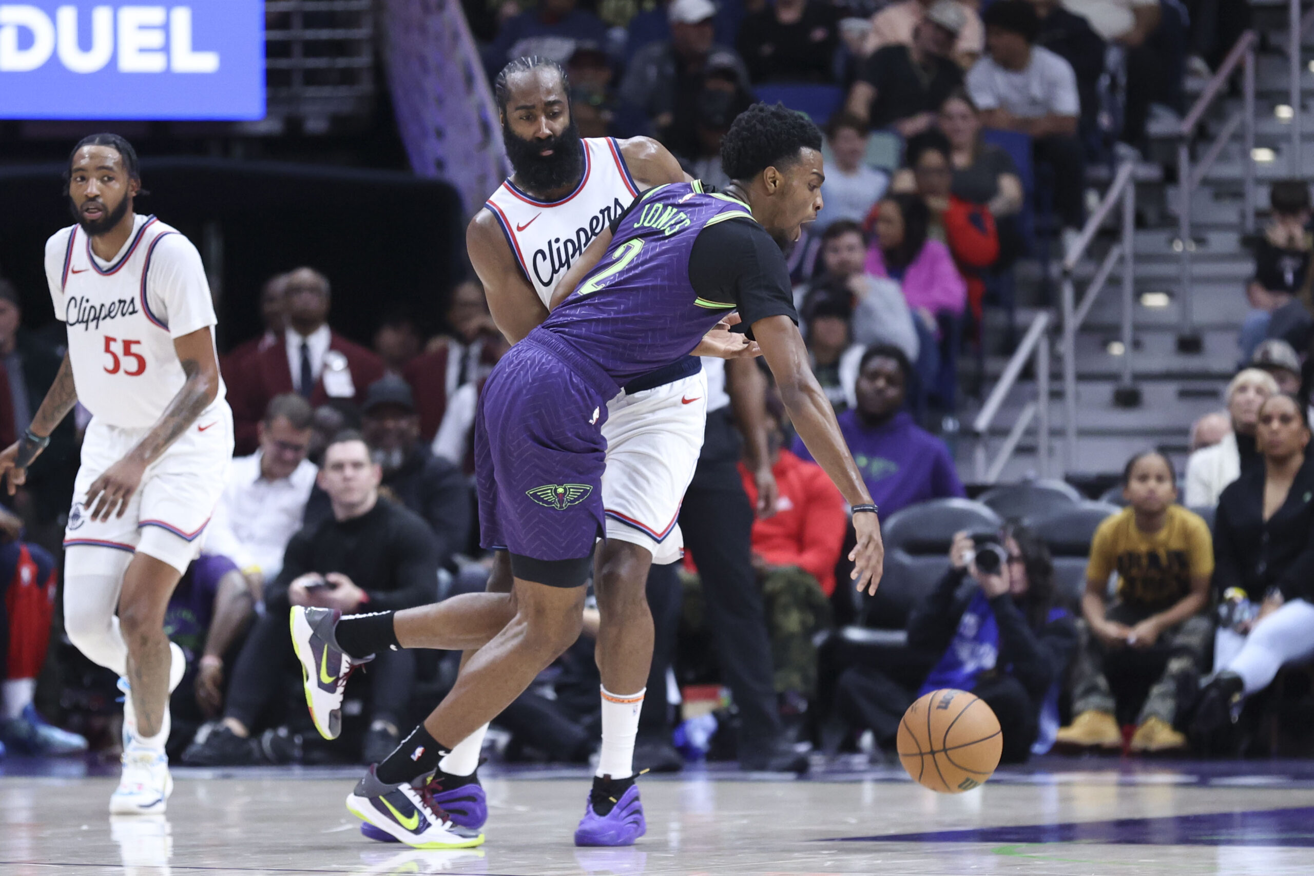 New Orleans Pelicans forward Herbert Jones (2) makes contact with...