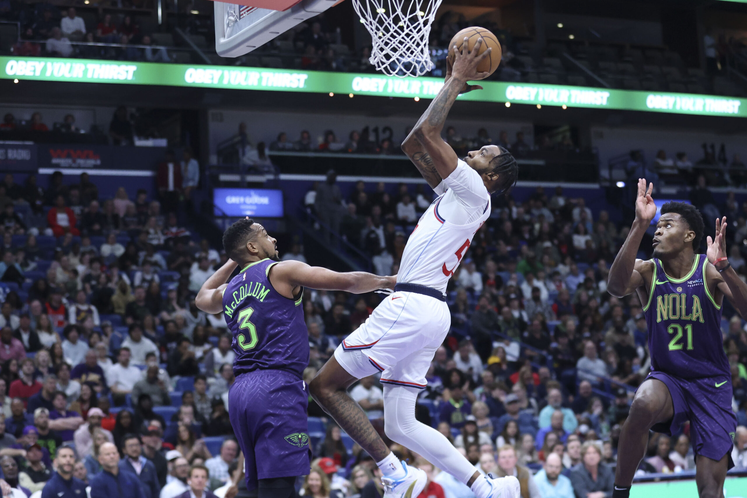 Clippers forward Derrick Jones Jr. attempts a layup against New...