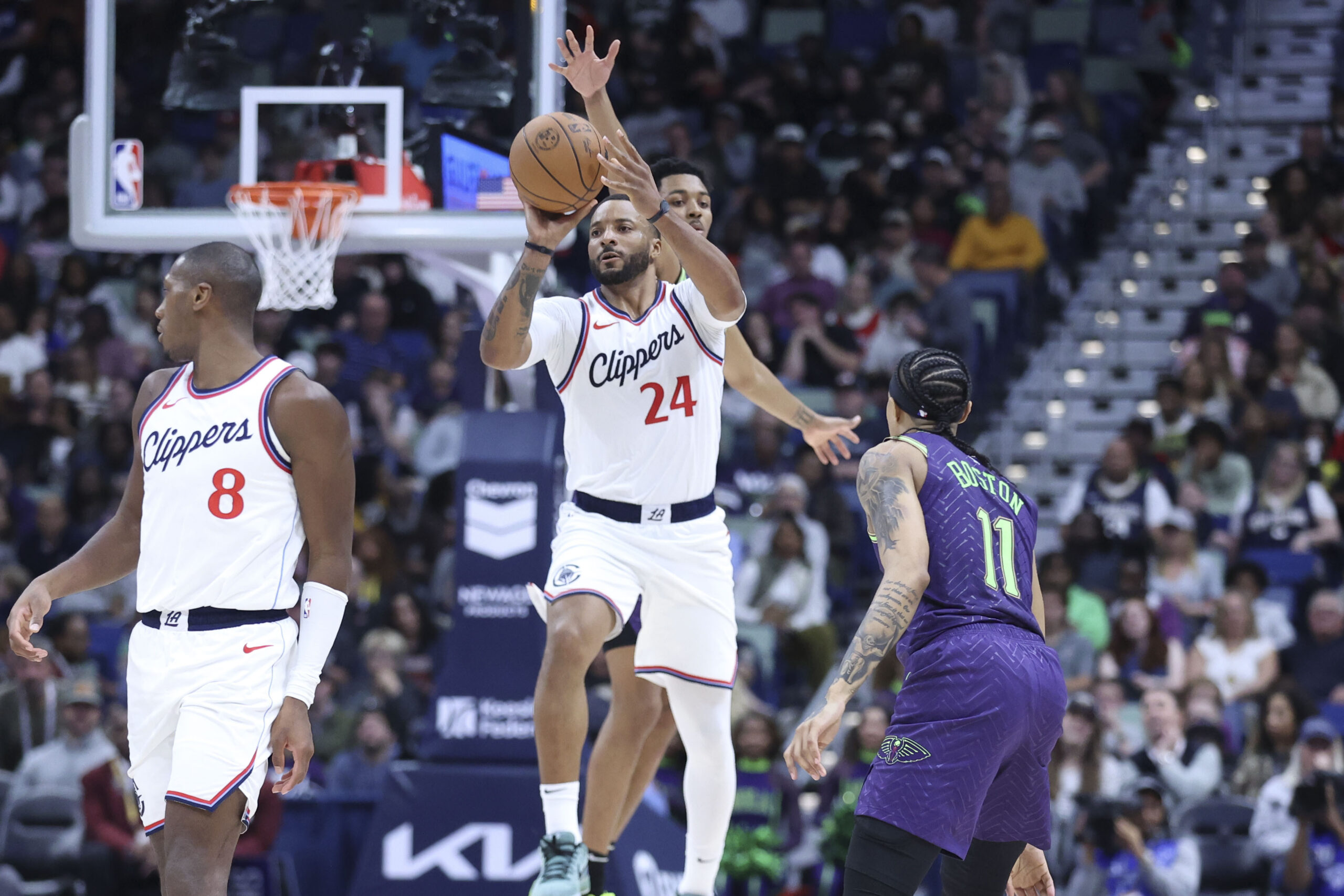 Clippers guard Norman Powell (24) shoots a last-second half court...