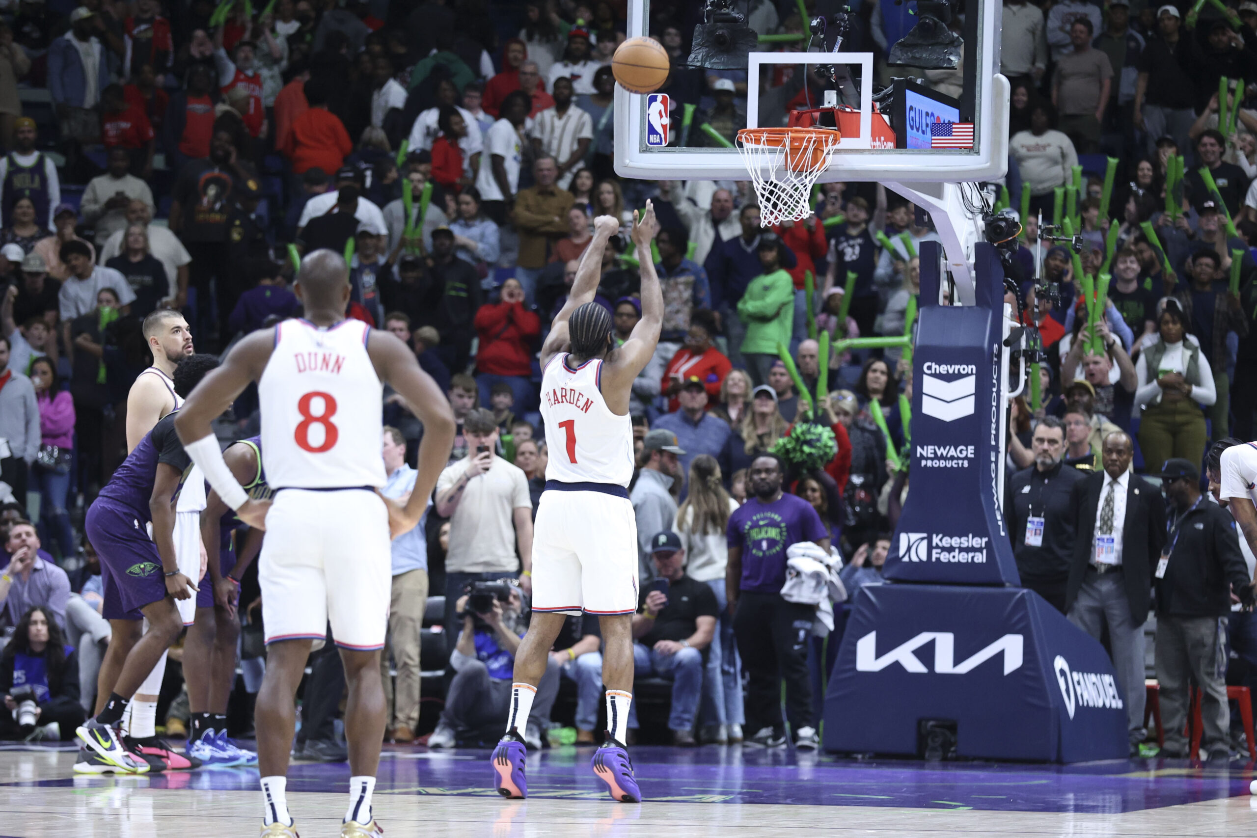 Clippers guard James Harden (1) hits the second of two...