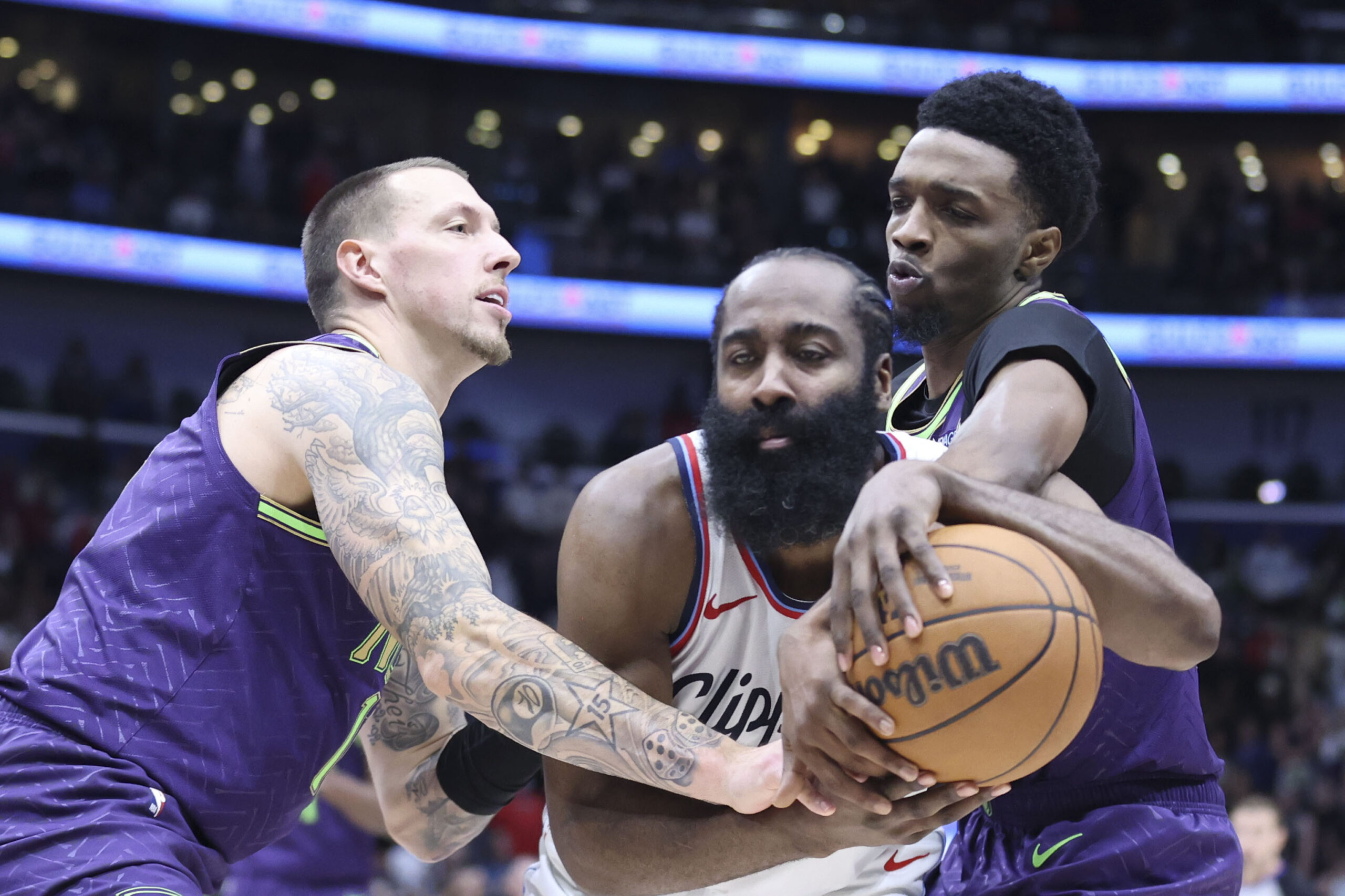 New Orleans Pelicans forward Herbert Jones, right, fouls Clippers guard...