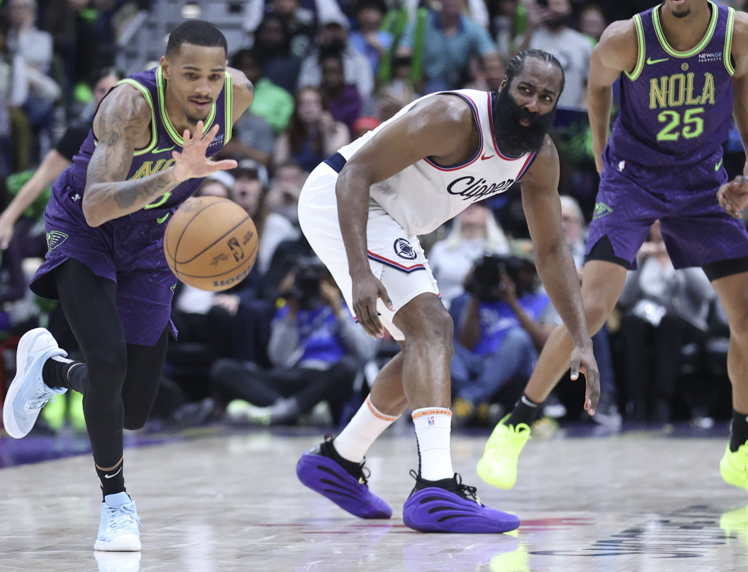 New Orleans Pelicans guard Dejounte Murray, left, fouls Clippers guard...