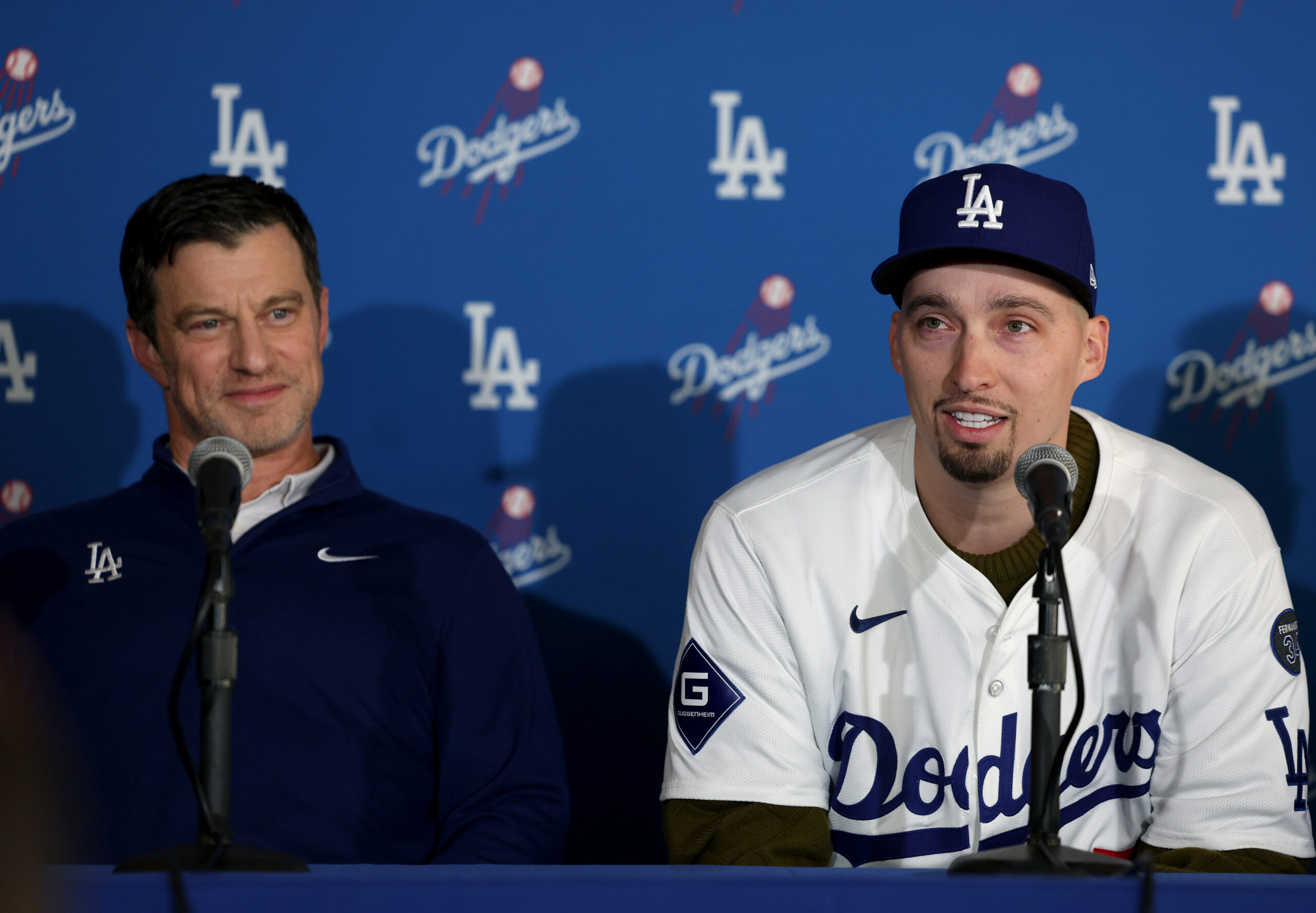 Dodgers president of baseball operations Andrew Friedman, left, and pitcher...