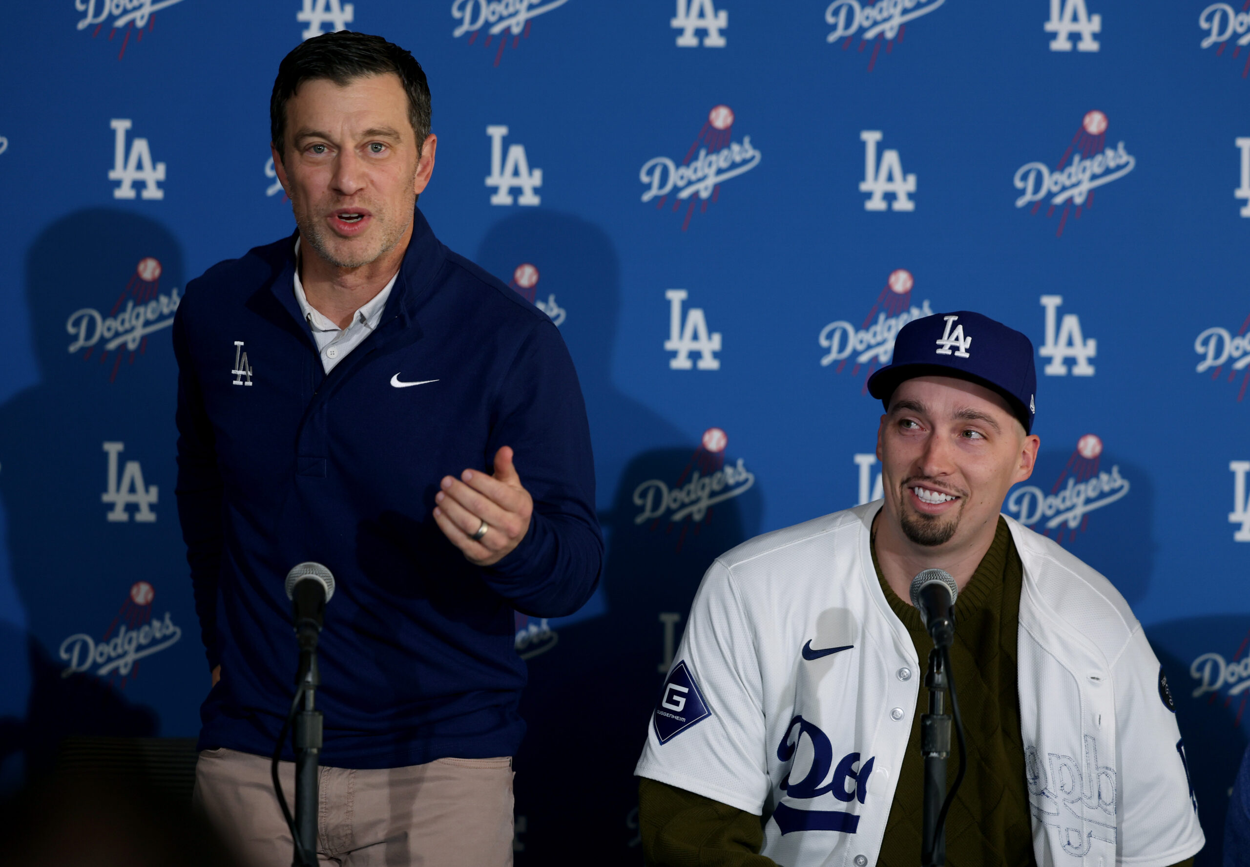 Dodgers president of baseball operations Andrew Friedman, left, and pitcher...