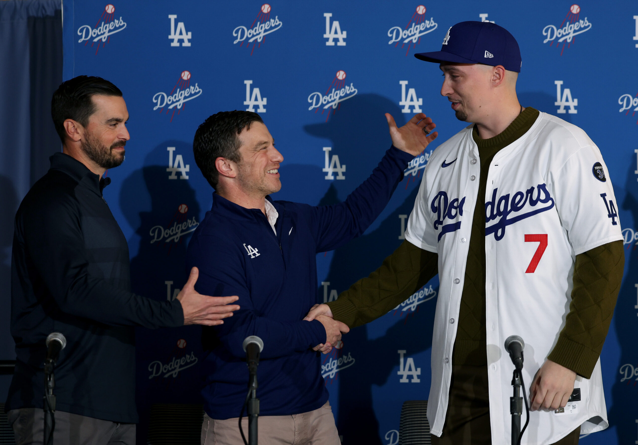 Dodgers president of baseball operations Andrew Friedman, center, and Dodgers...