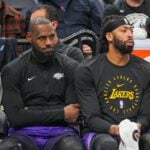 Dec 2, 2024; Minneapolis, Minnesota, USA; Los Angeles Lakers forward LeBron James (23) and forward Anthony Davis (3) on the bench against the Minnesota Timberwolves in the fourth quarter at Target Center. Mandatory Credit: Brad Rempel-Imagn Images