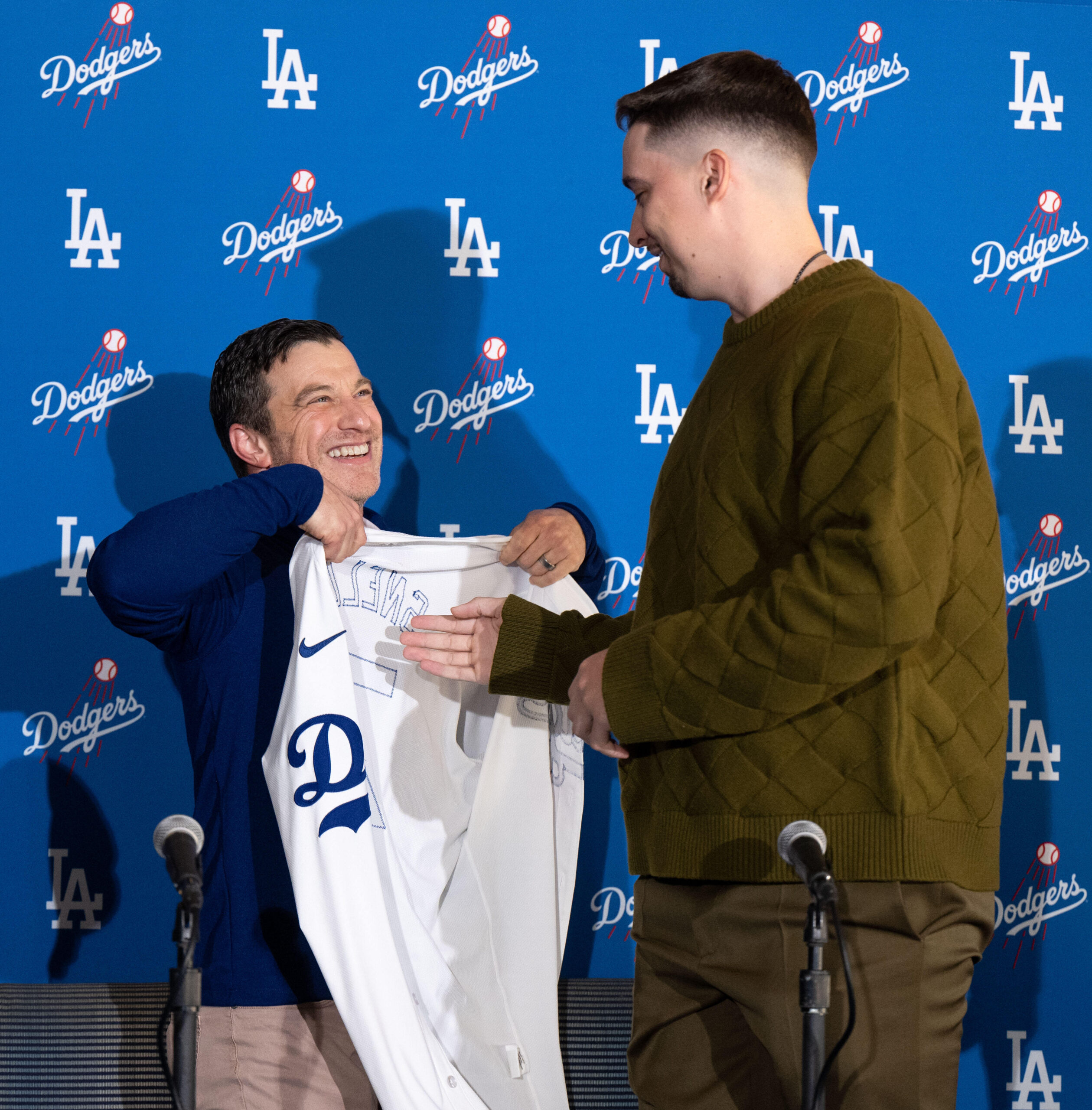 Dodgers president of baseball operations Andrew Friedman, left, presents pitcher...