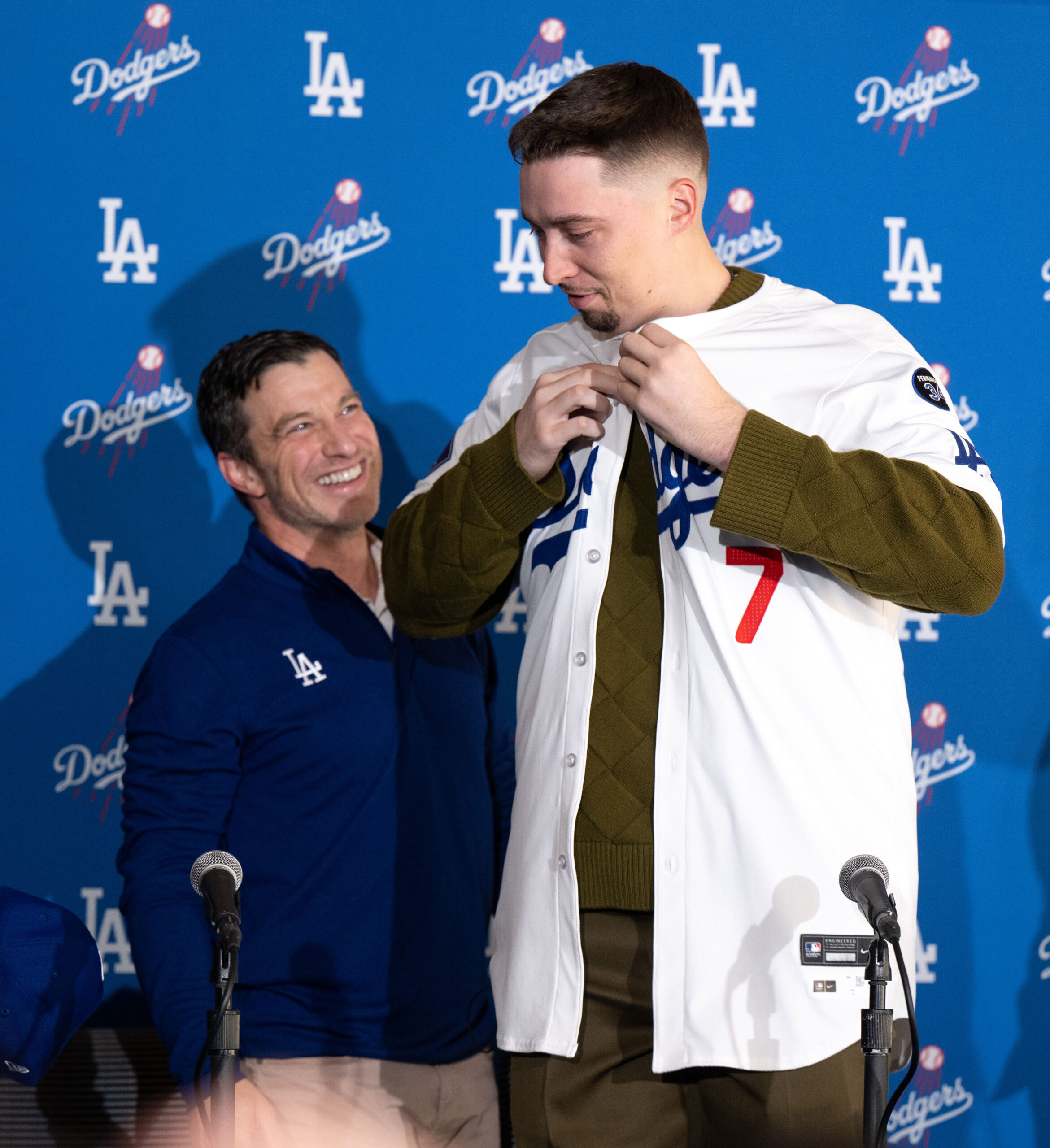 Dodgers president of baseball operations Andrew Friedman, left, presents pitcher...