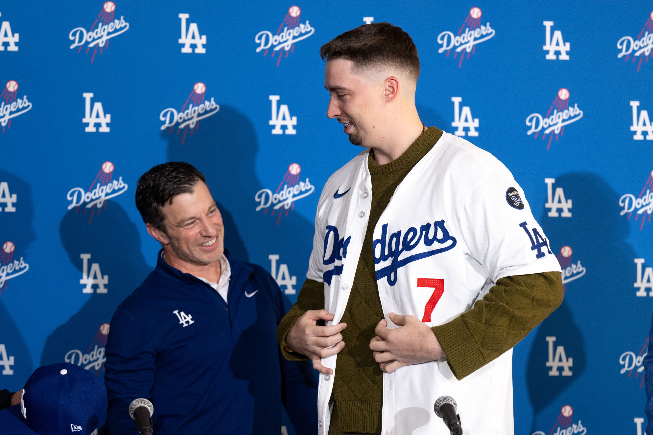 Dodgers president of baseball operations Andrew Friedman, left, presents pitcher...