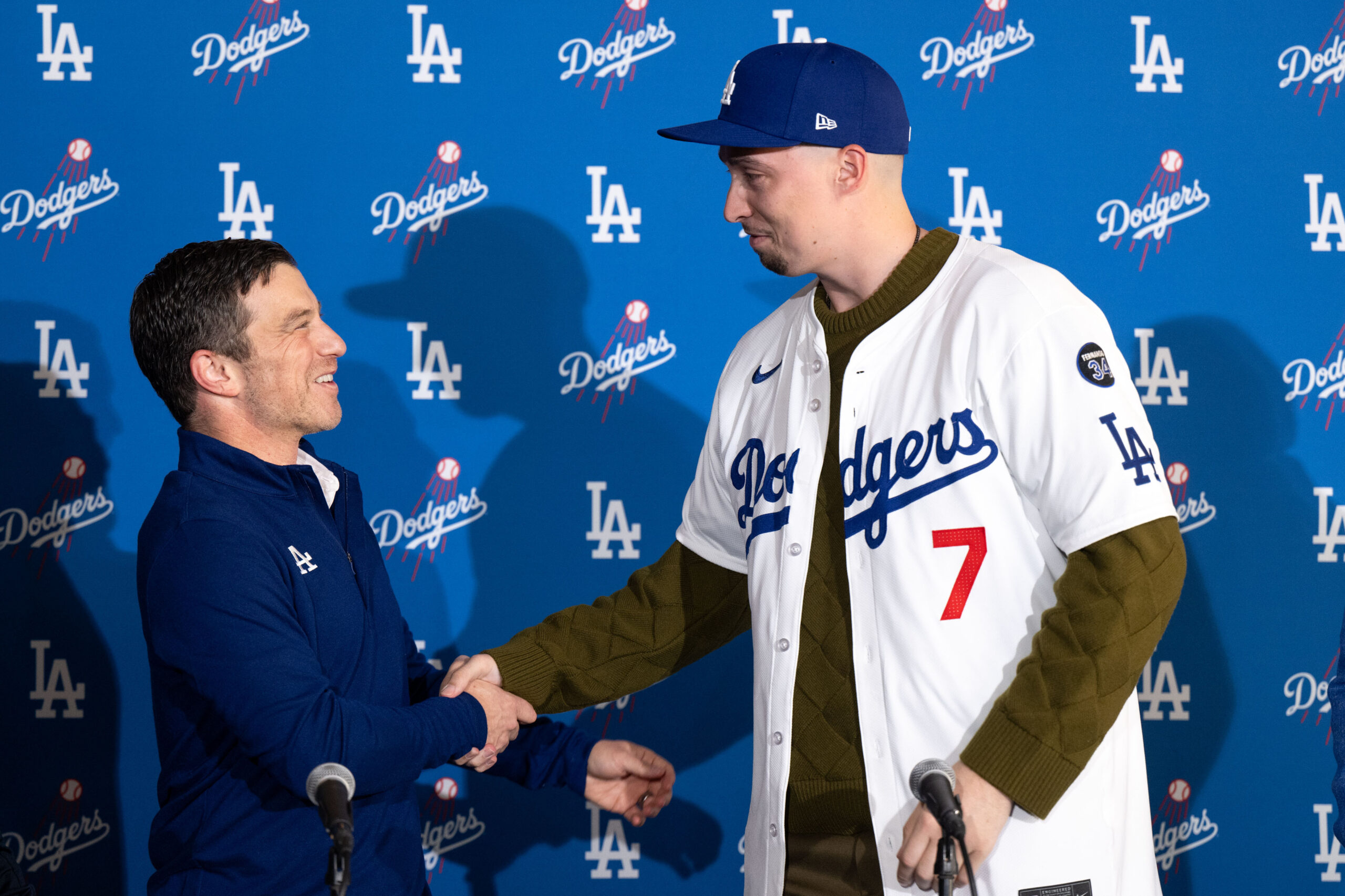 Dodgers president of baseball operations Andrew Friedman, left, presents pitcher...