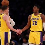 Nov 13, 2024; Los Angeles, California, USA; Los Angeles Lakers forward Rui Hachimura (28) is greeted by guard Dalton Knecht (4) after scoring a basket during the third quarter at Crypto.com Arena. Mandatory Credit: Kiyoshi Mio-Imagn Images