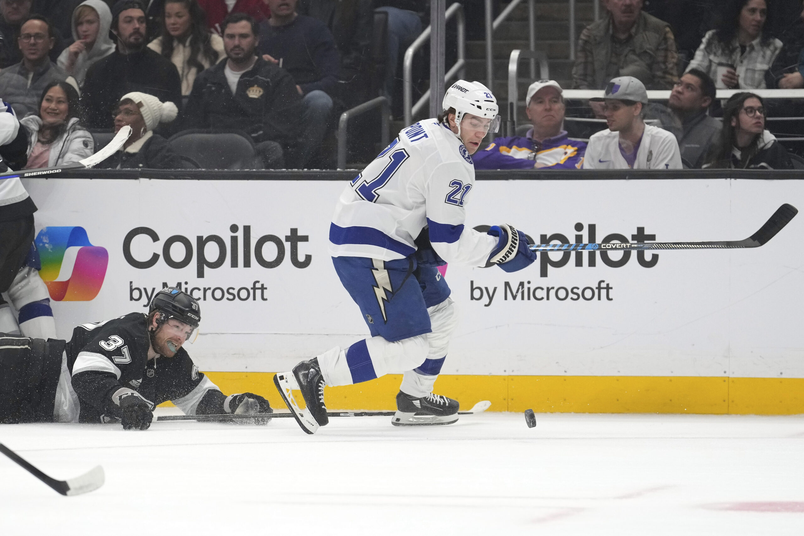 Tampa Bay Lightning center Brayden Point, right, takes the puck...