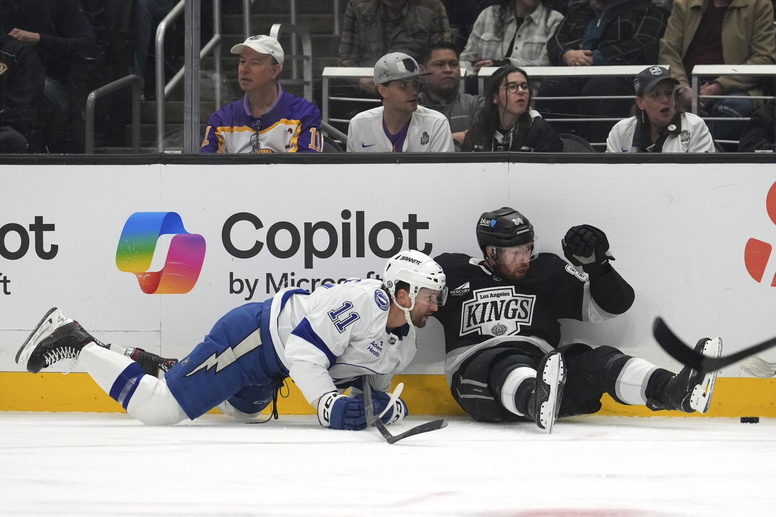 Tampa Bay Lightning center Luke Glendening, left, and Kings defenseman...