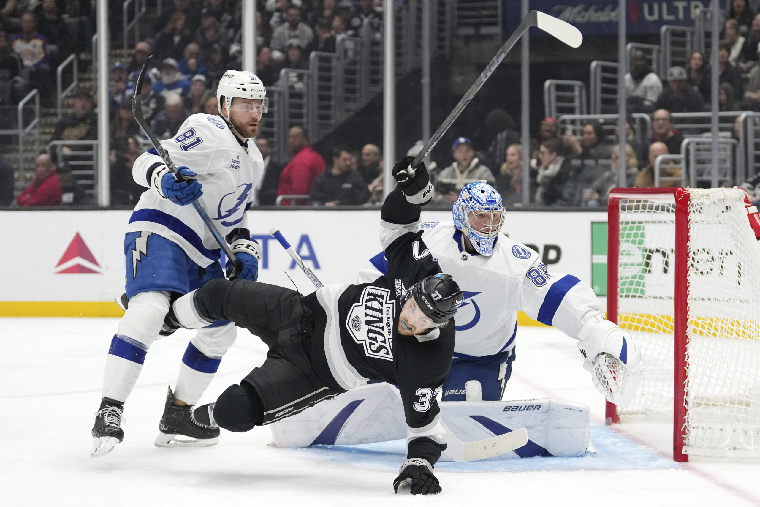 Tampa Bay Lightning goaltender Andrei Vasilevskiy, right, deflects a shot...