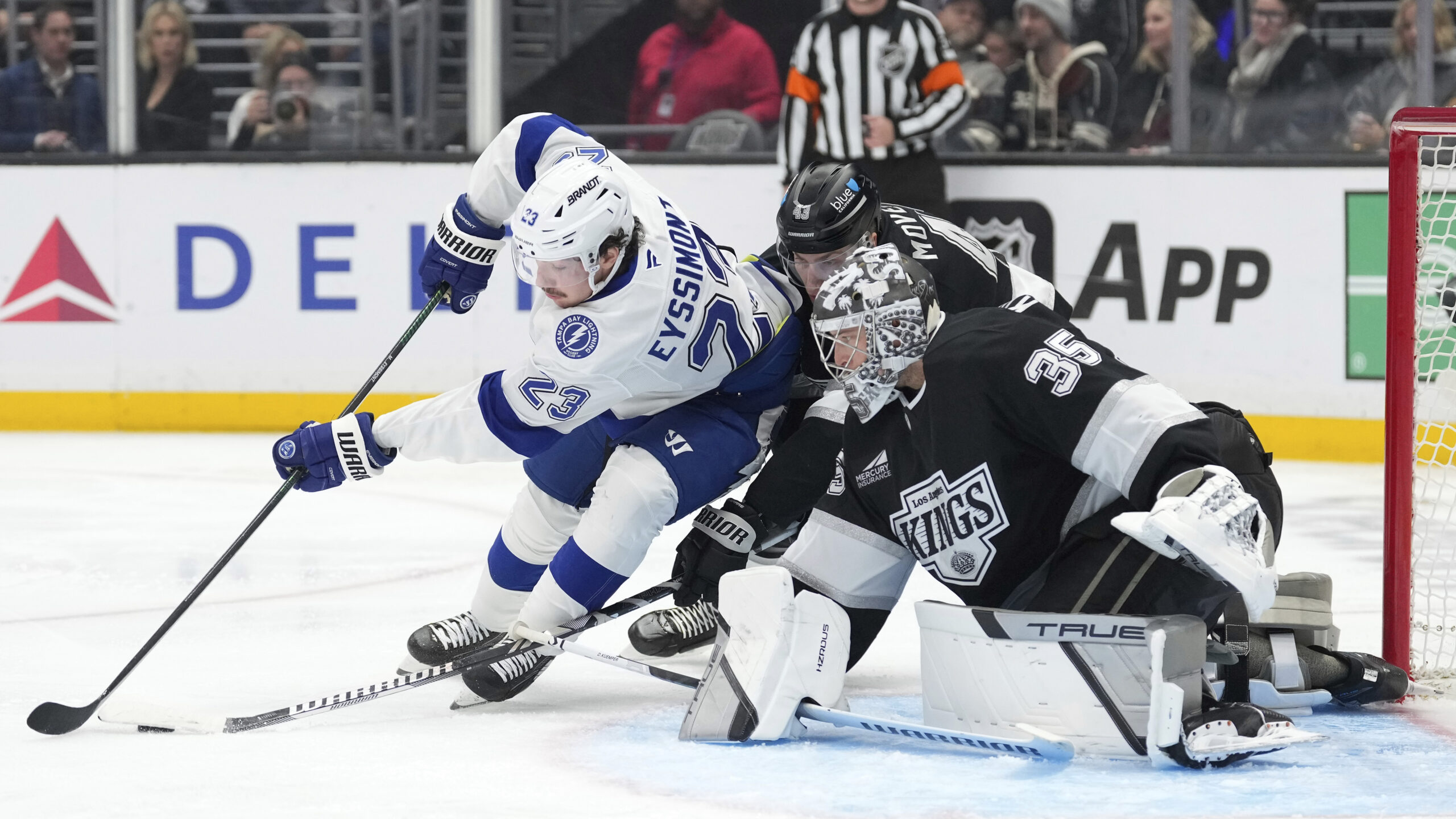 Tampa Bay Lightning center Michael Eyssimont, left, tries to get...