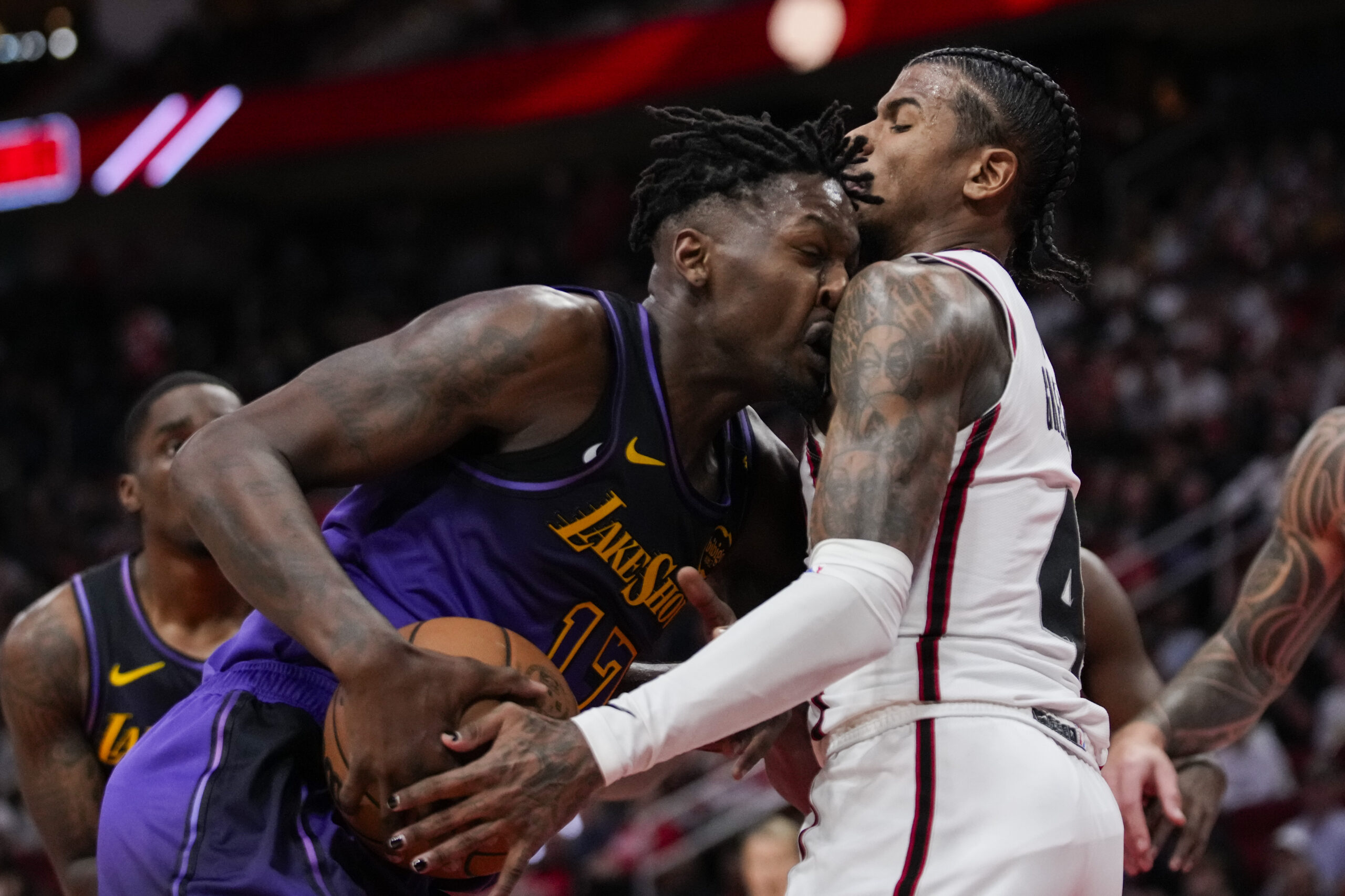 Lakers forward Dorian Finney-Smith (17) collides with Houston Rockets guard...