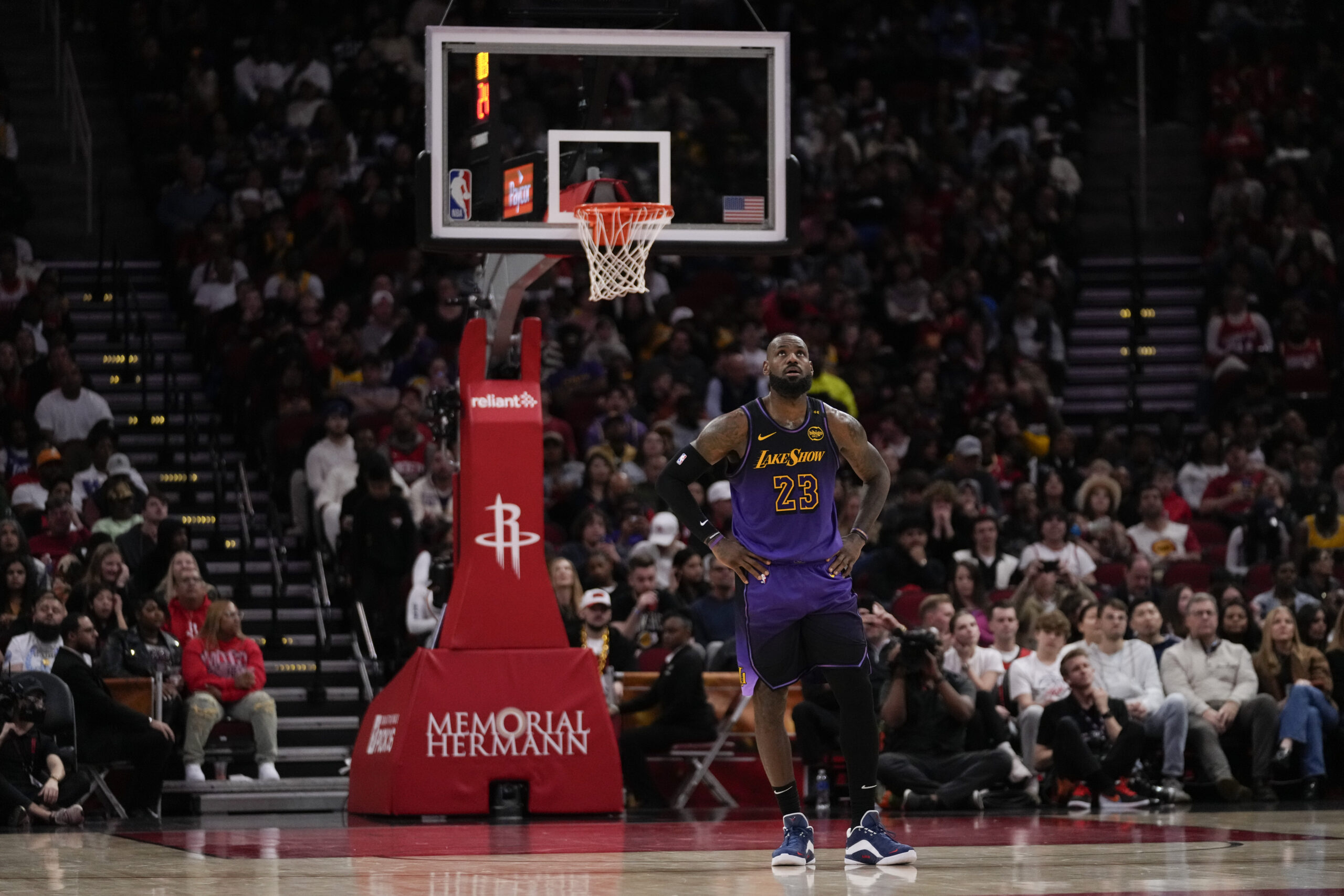 Lakers forward LeBron James (23) stands on the court during...