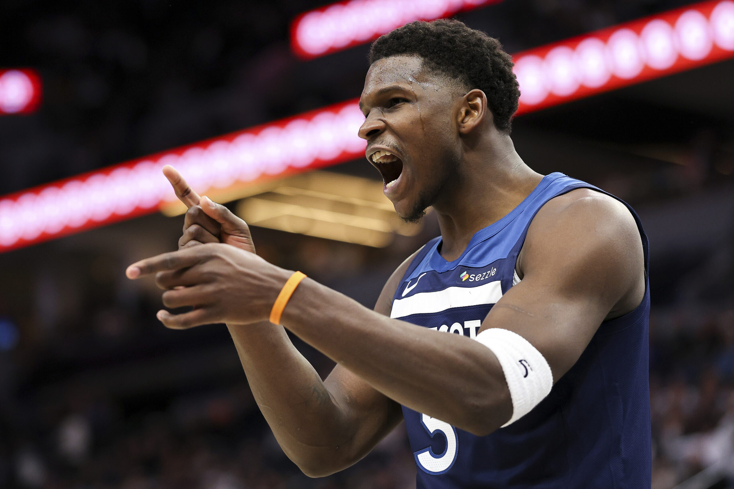 Minnesota Timberwolves guard Anthony Edwards celebrates after his basket during...