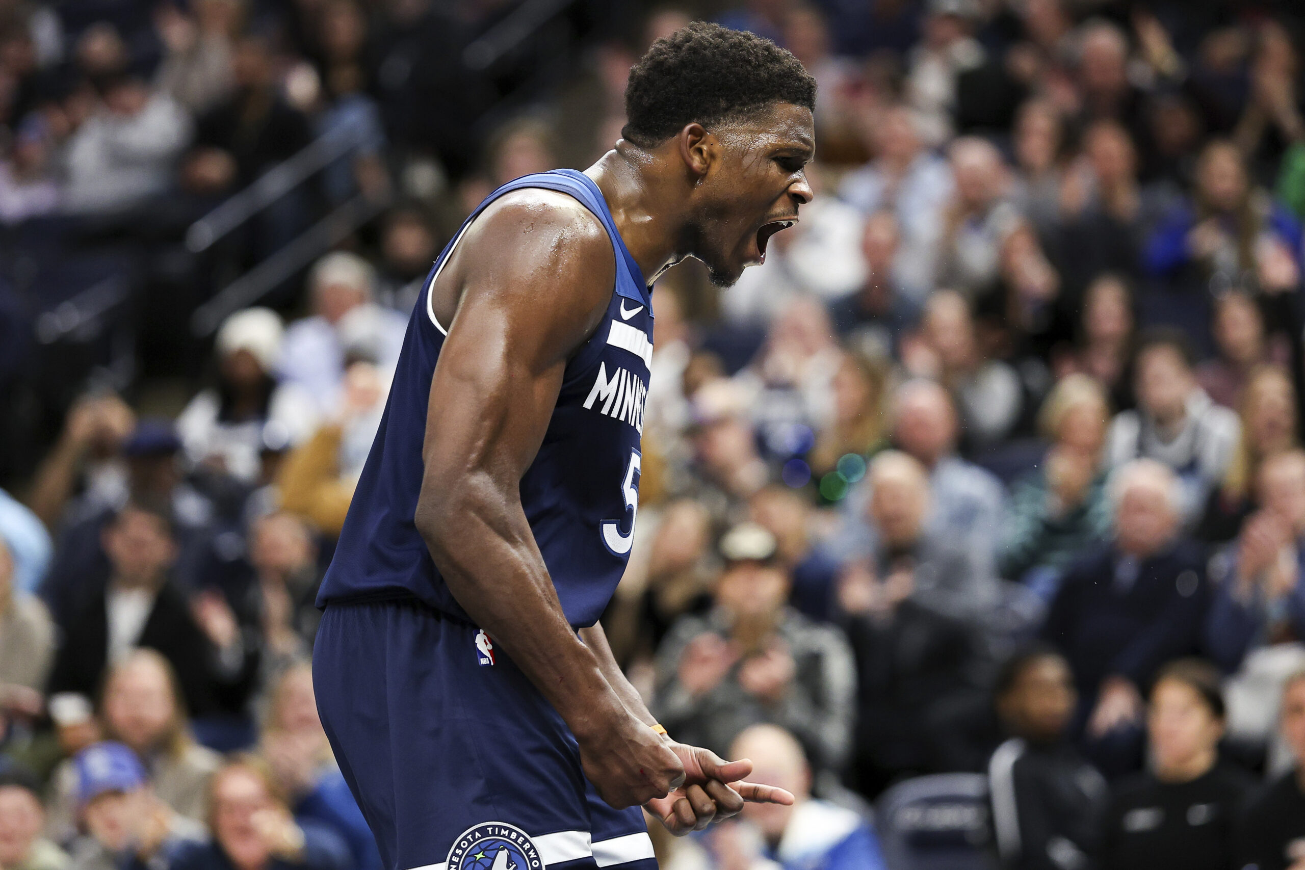 Minnesota Timberwolves guard Anthony Edwards celebrates after making a shot...