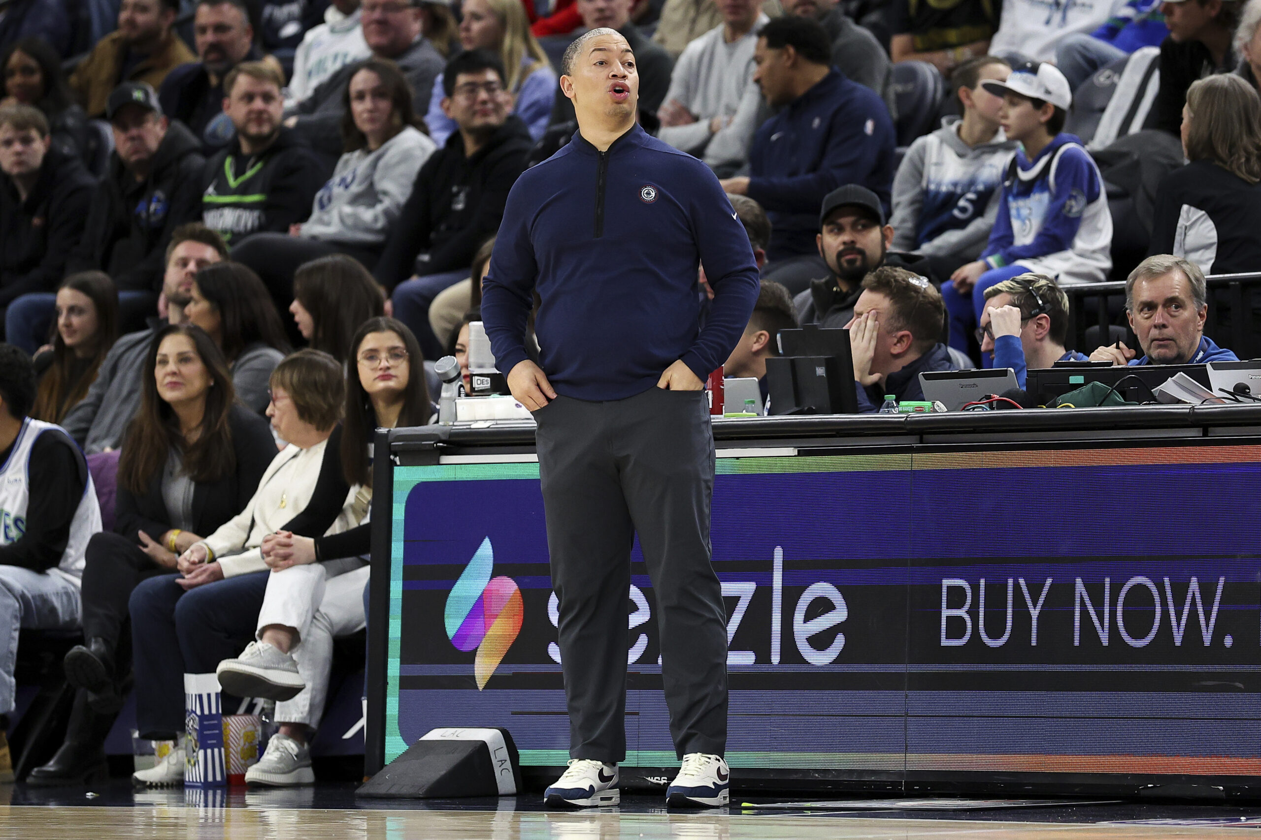 Clippers head coach Tyronn Lue, center, reacts on the sideline...