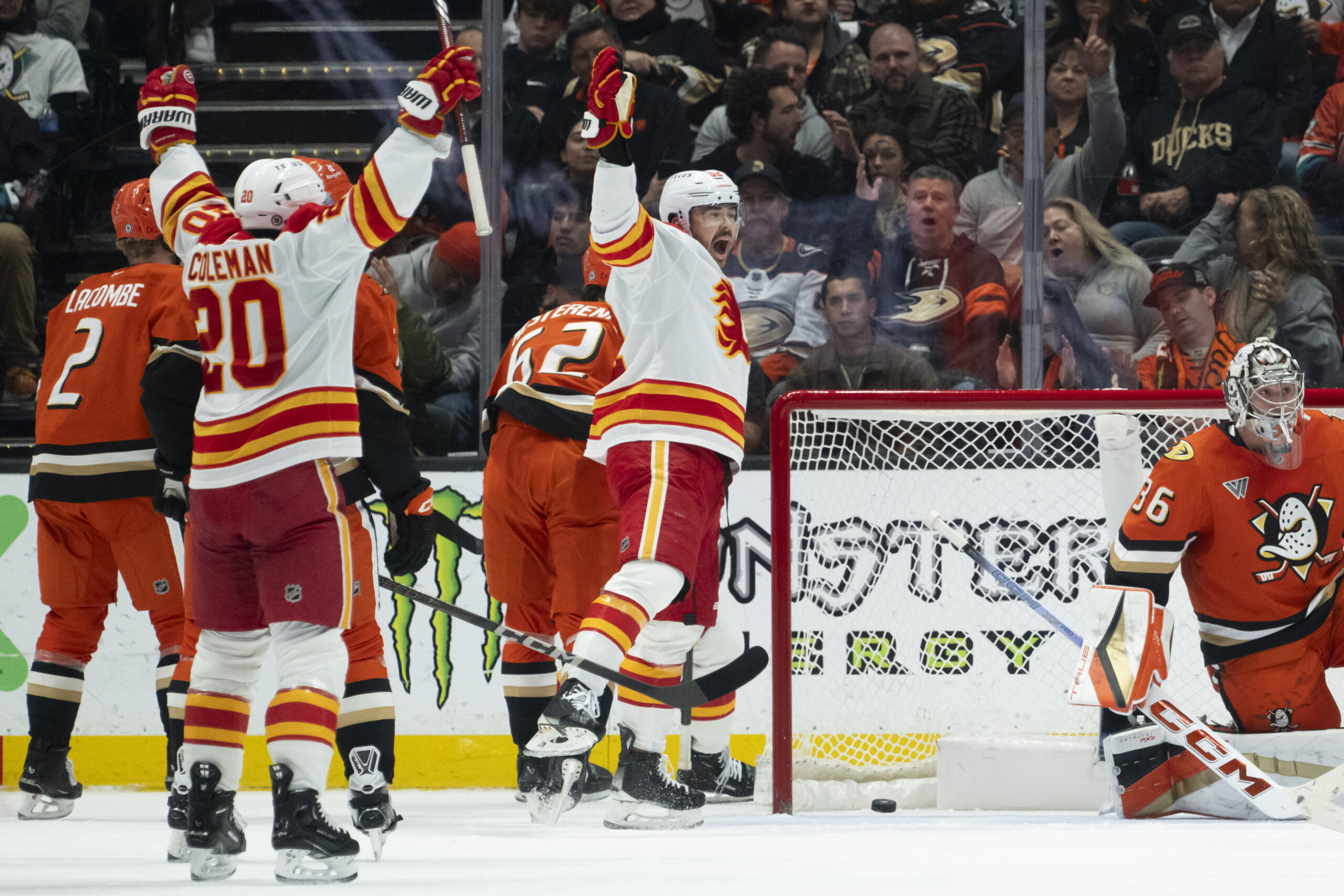 Calgary Flames defenseman MacKenzie Weegar reacts after scoring a goal...