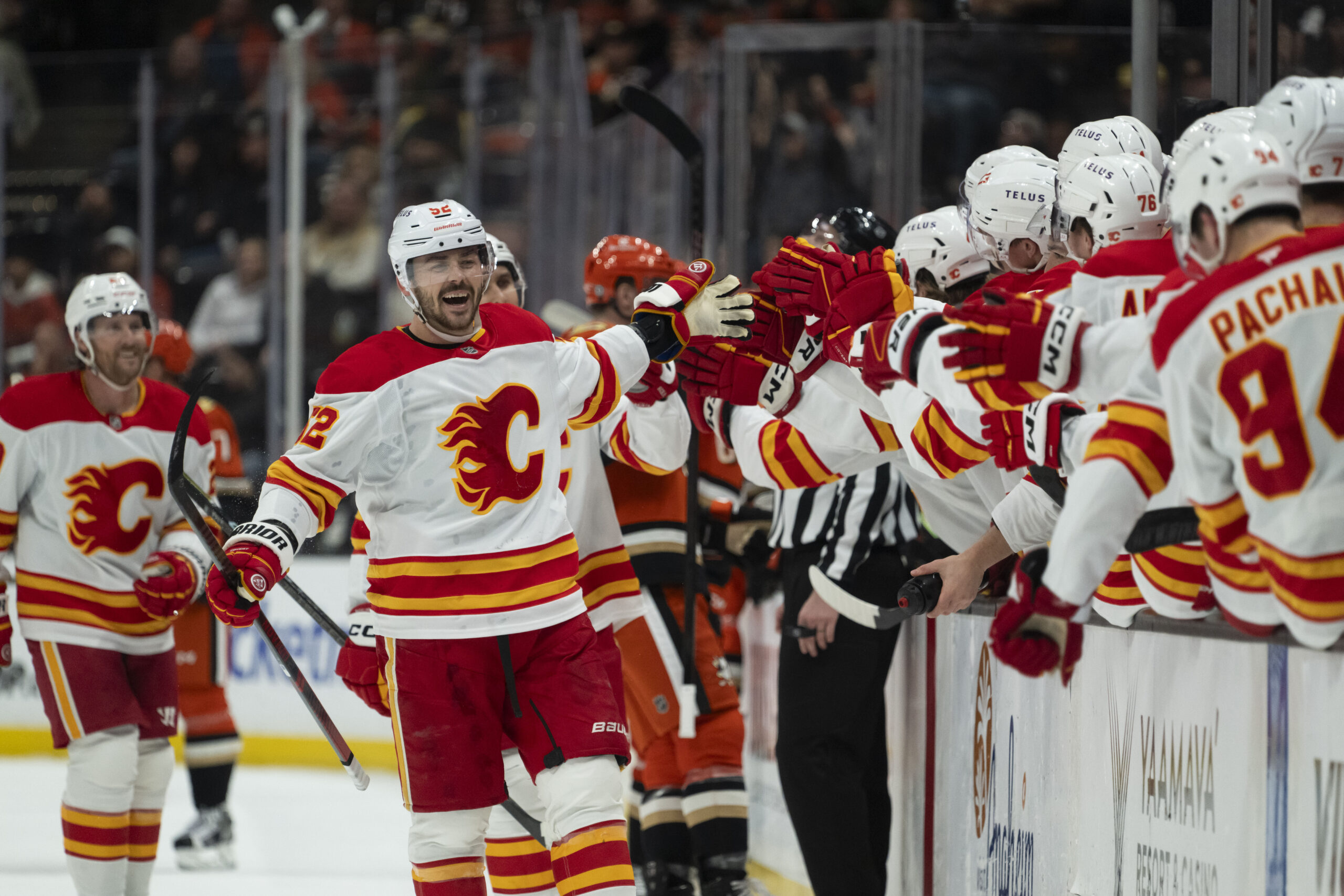 Calgary Flames defenseman MacKenzie Weegar celebrates his goal with the...