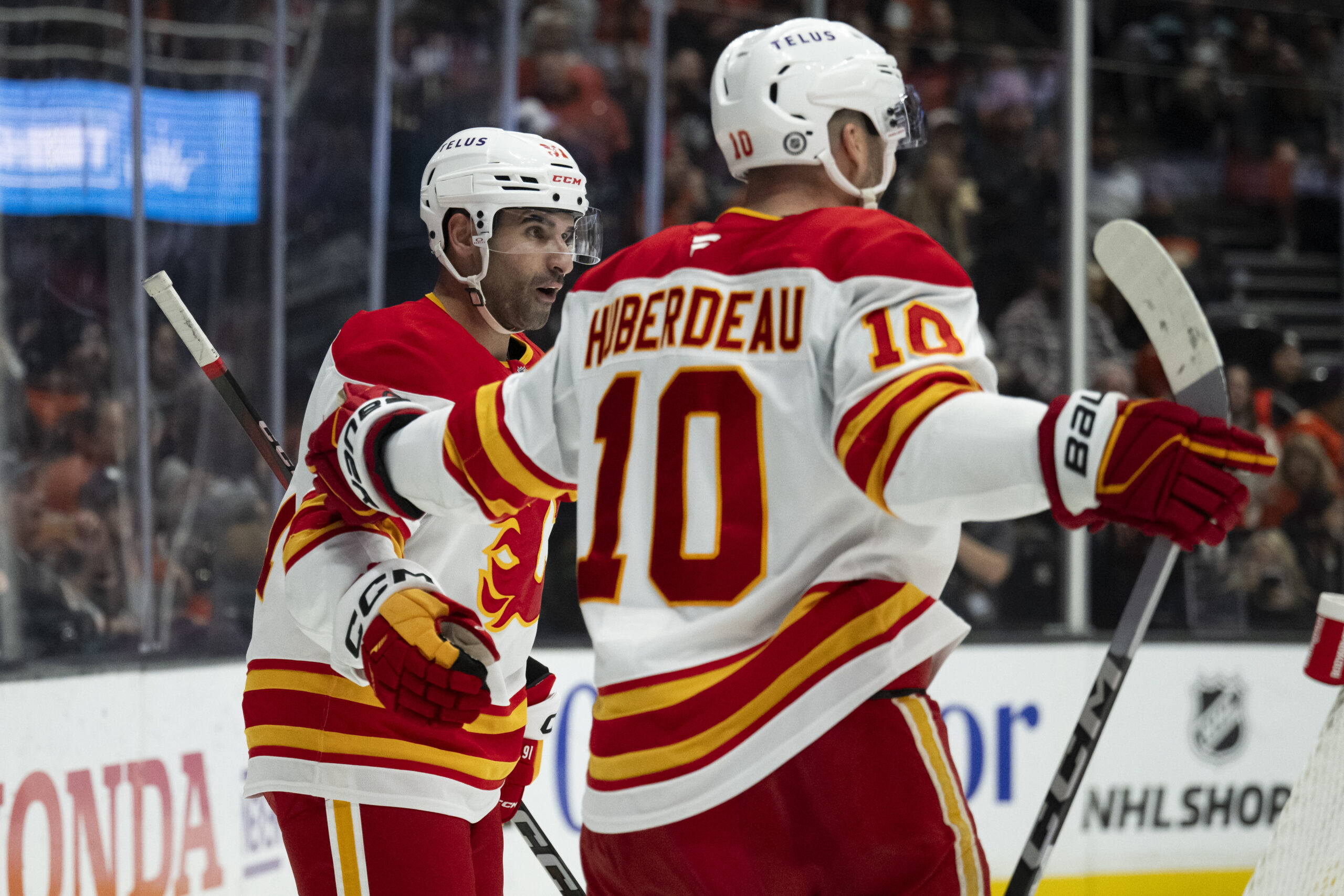 Calgary Flames center Nazem Kadri, left, celebrates his goal with...