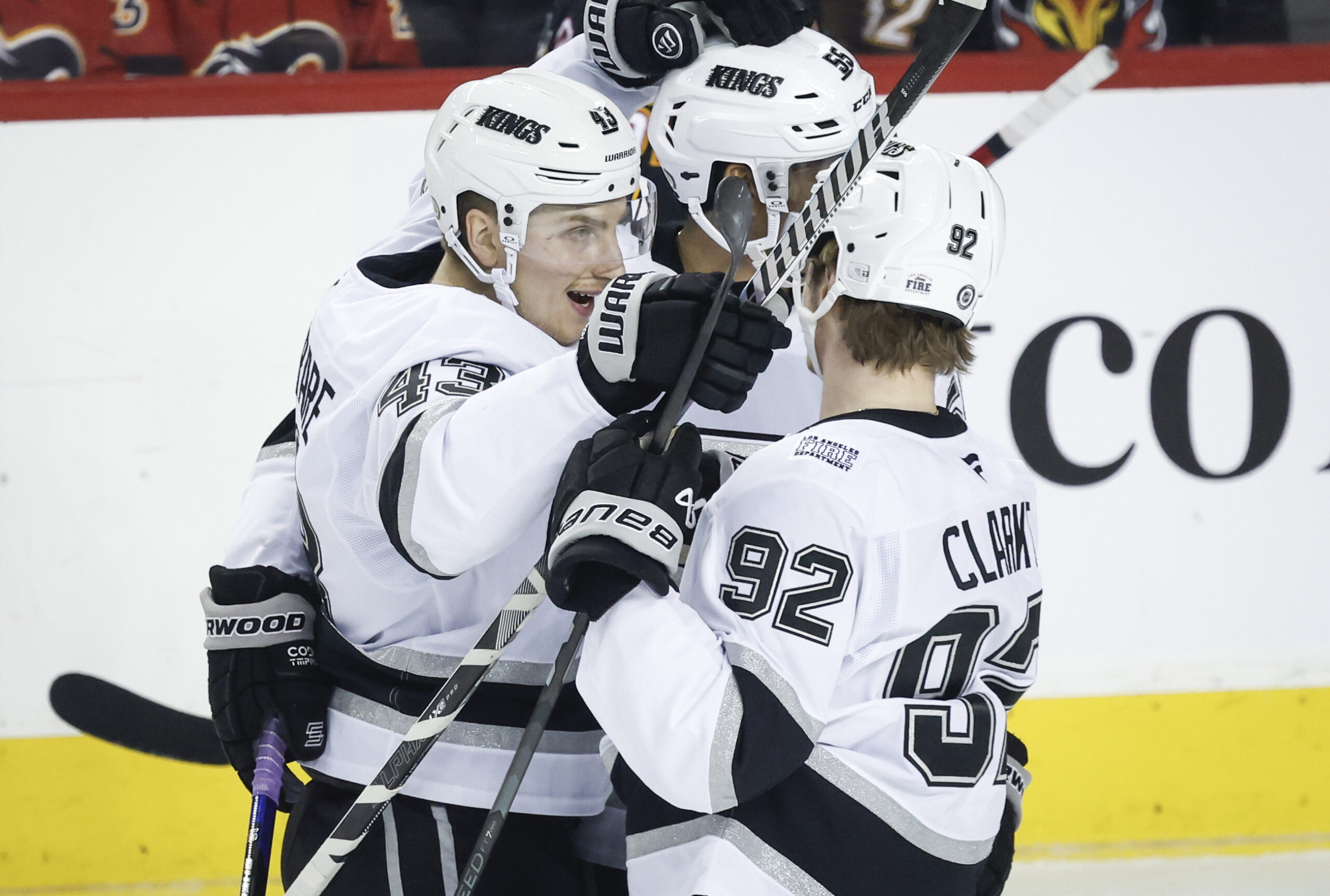 Kings’ Jacob Moverare, left, celebrates after his goal with teammates...