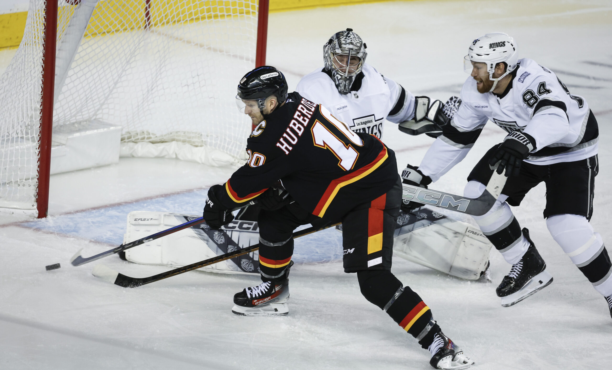 Calgary Flames’ Jonathan Huberdeau, left, scores on Kings goalie David...