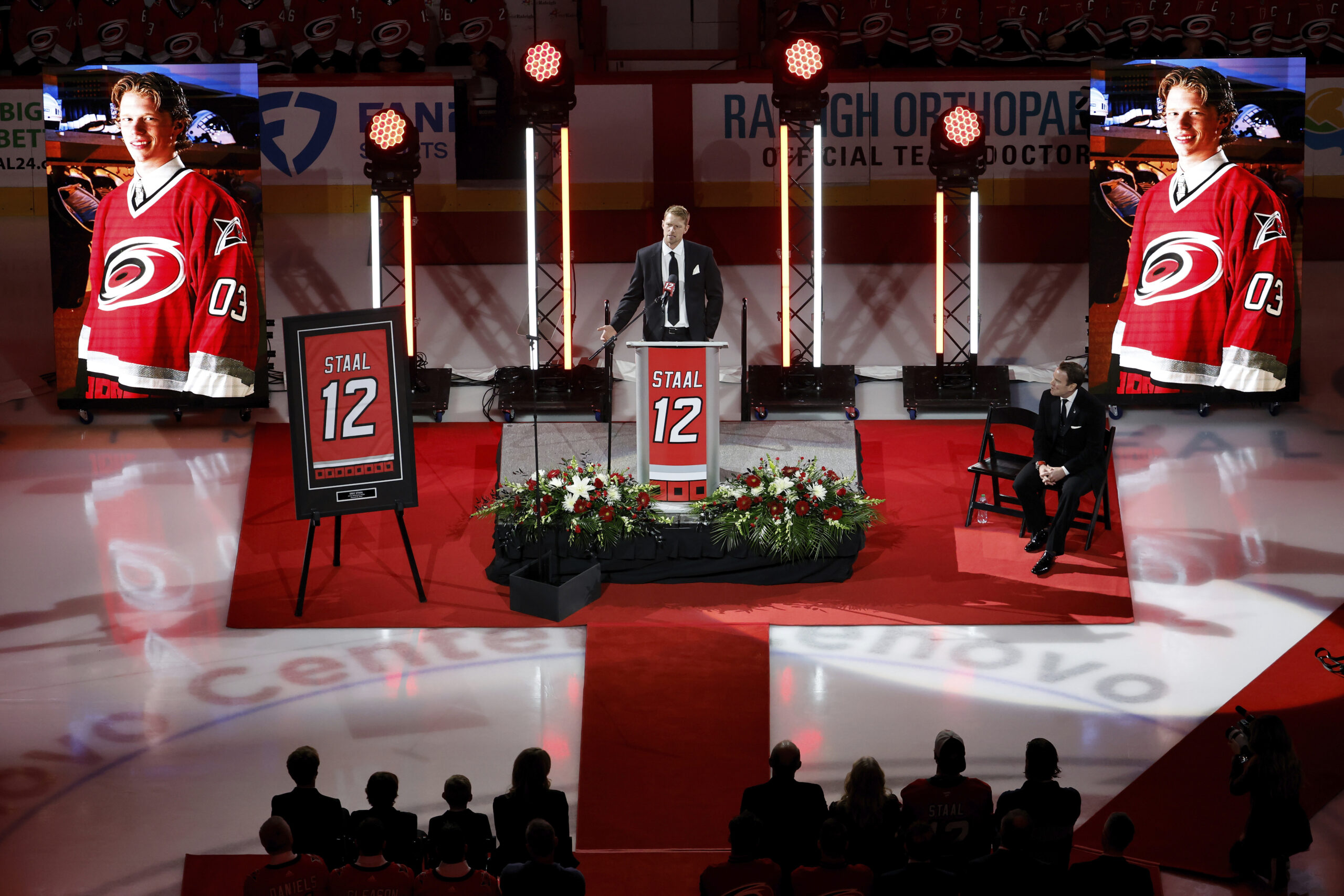 Former Carolina Hurricanes player Eric Staal, center, speaks during a...