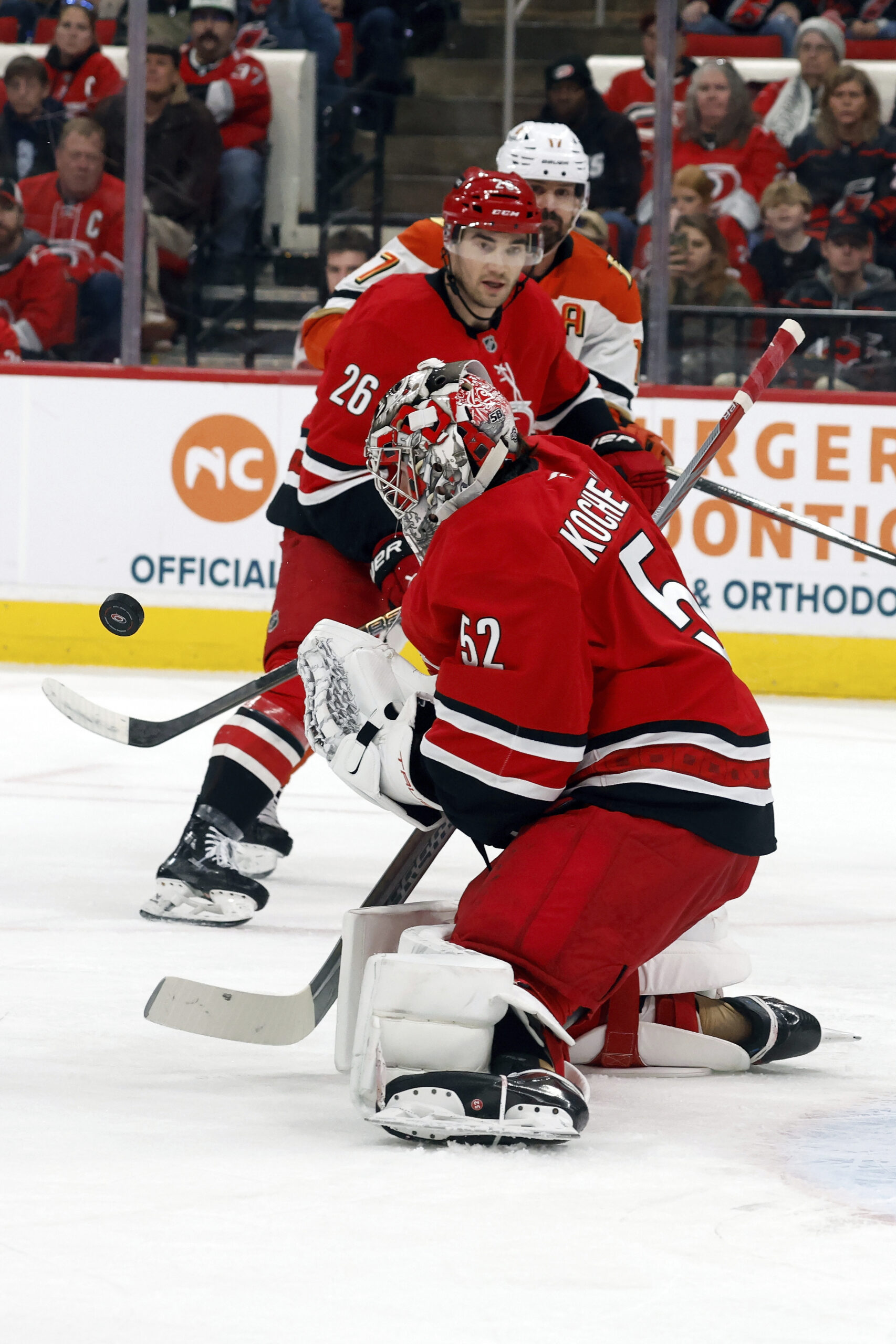 Carolina Hurricanes goaltender Pyotr Kochetkov (52) blocks a shot by...