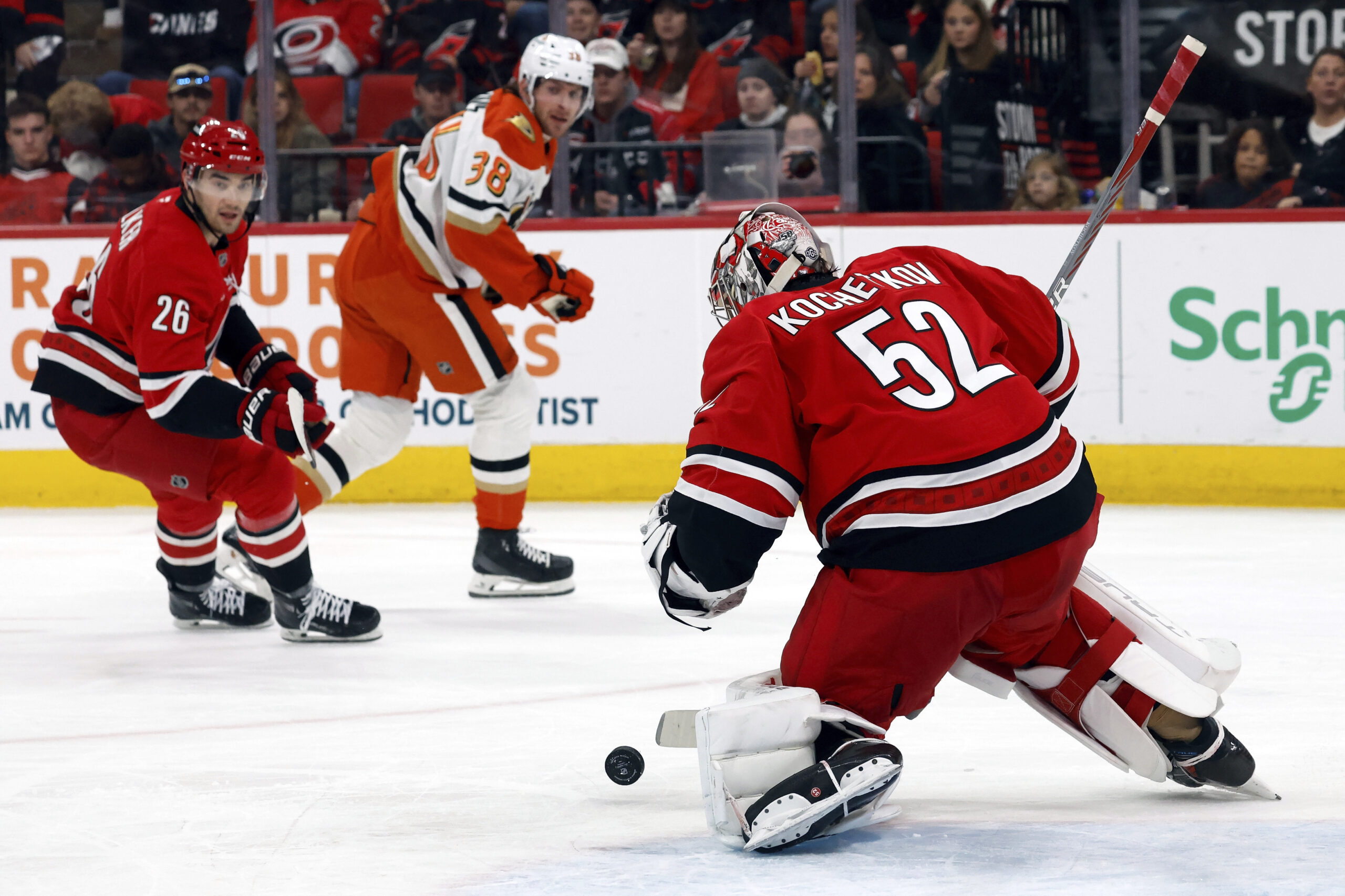 Carolina Hurricanes goaltender Pyotr Kochetkov (52) blocks a shot by...