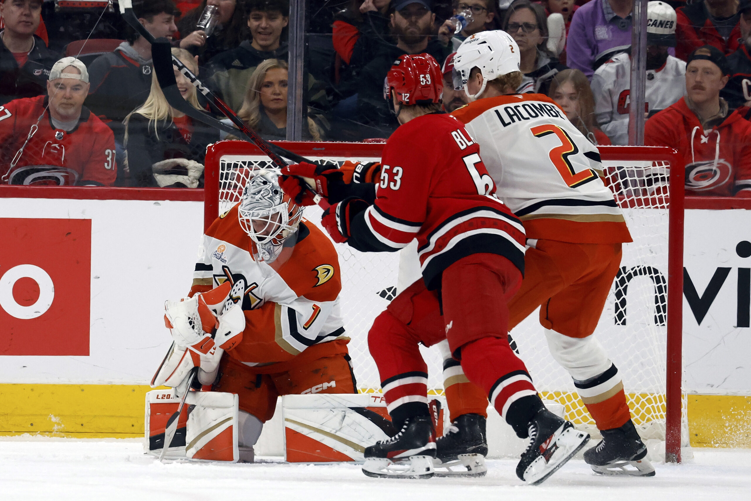 Ducks goaltender Lukas Dostal (1) catches the puck as teammate...