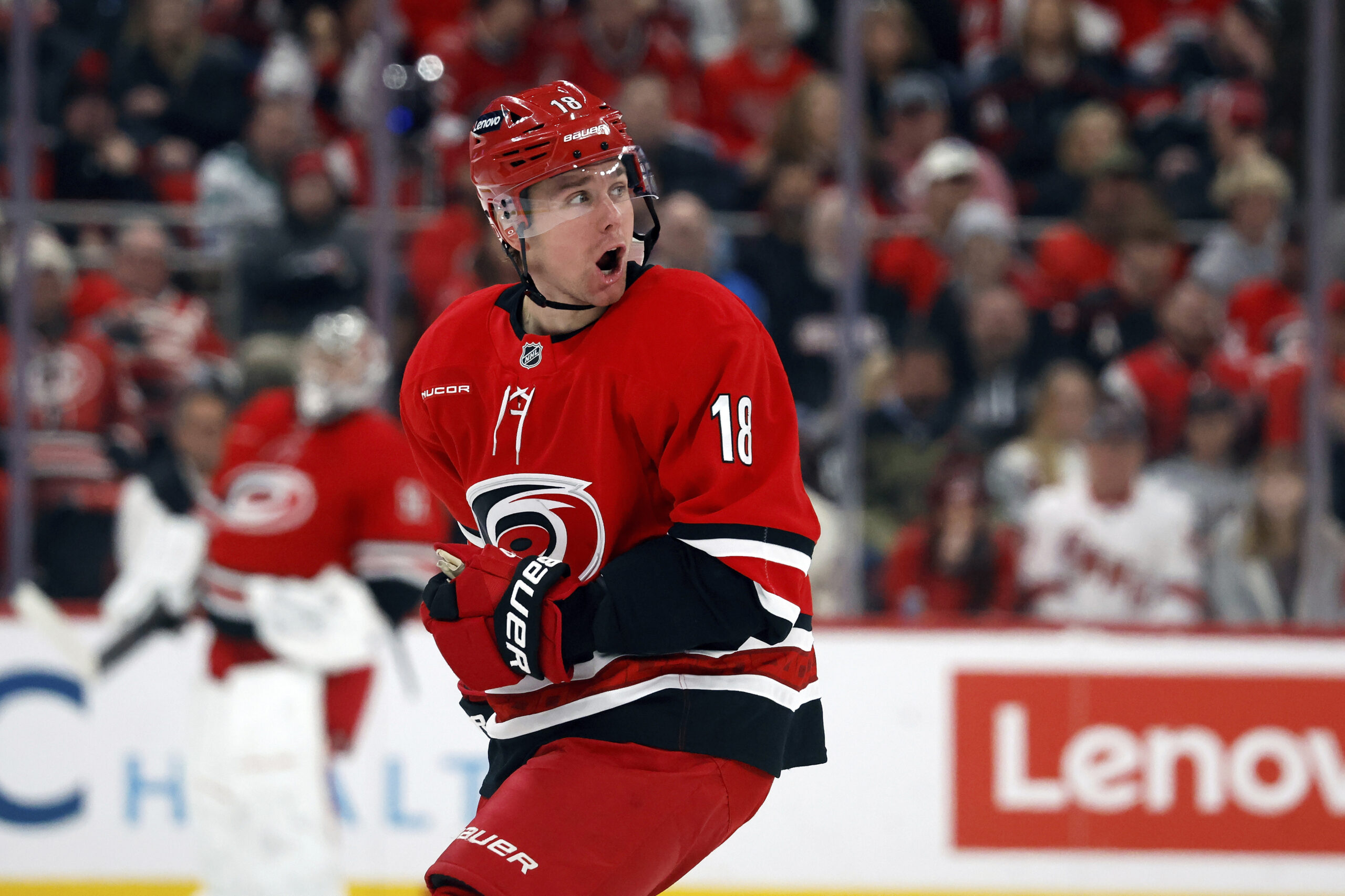 Carolina Hurricanes’ Jack Drury (18) protests after being called for...