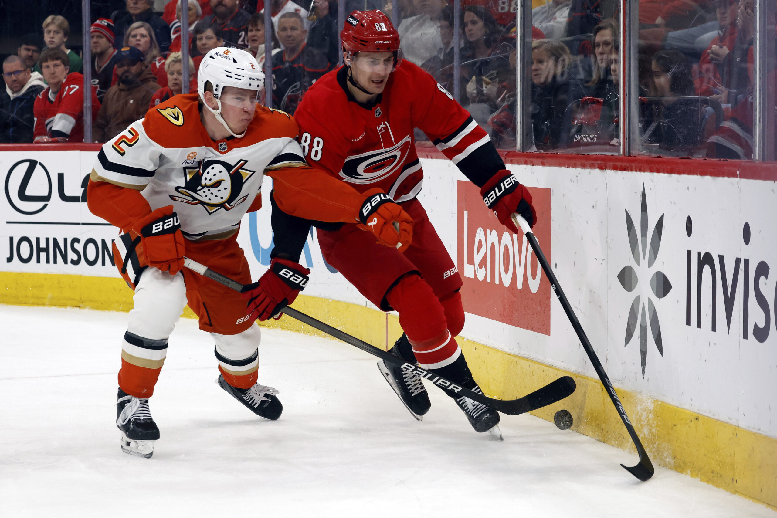 Carolina Hurricanes’ Martin Necas (88) battles with Ducks’ Jackson LaCombe...