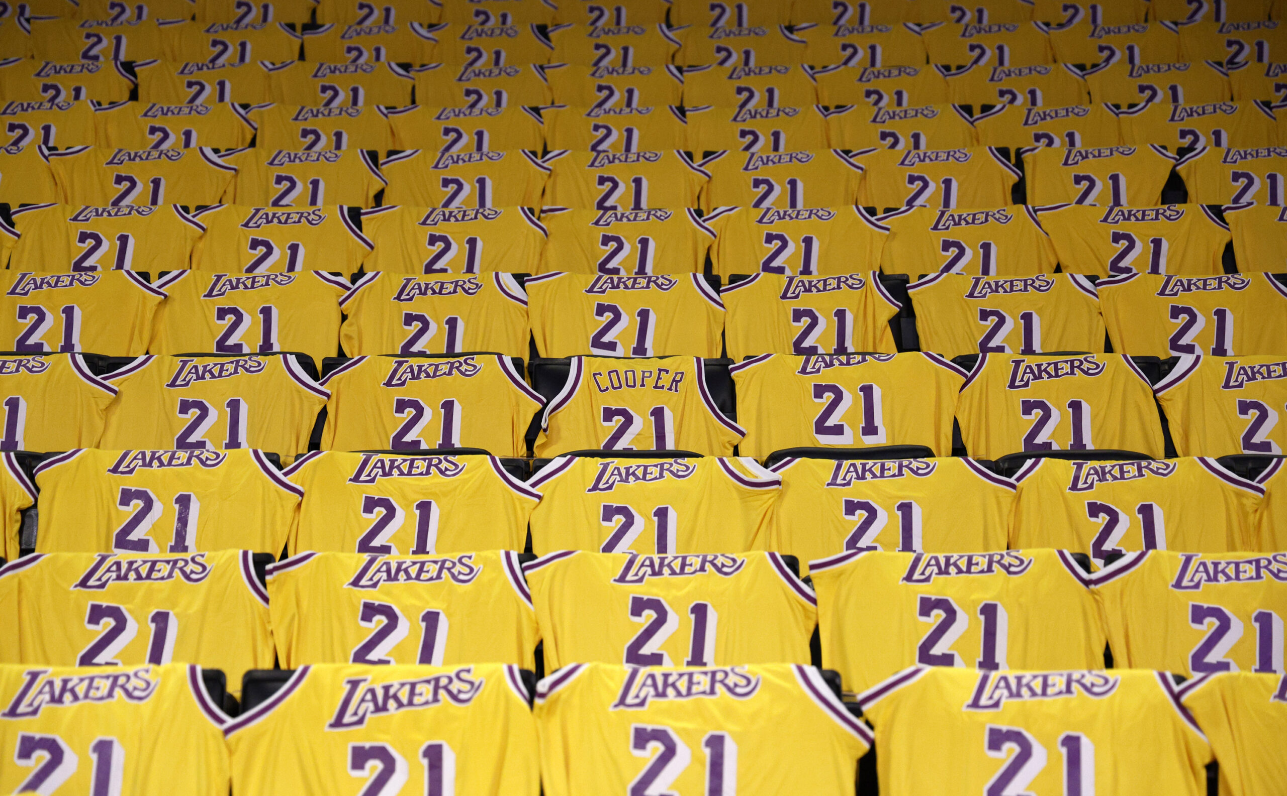 Jerseys with the number of former Lakers player Michel Cooper...