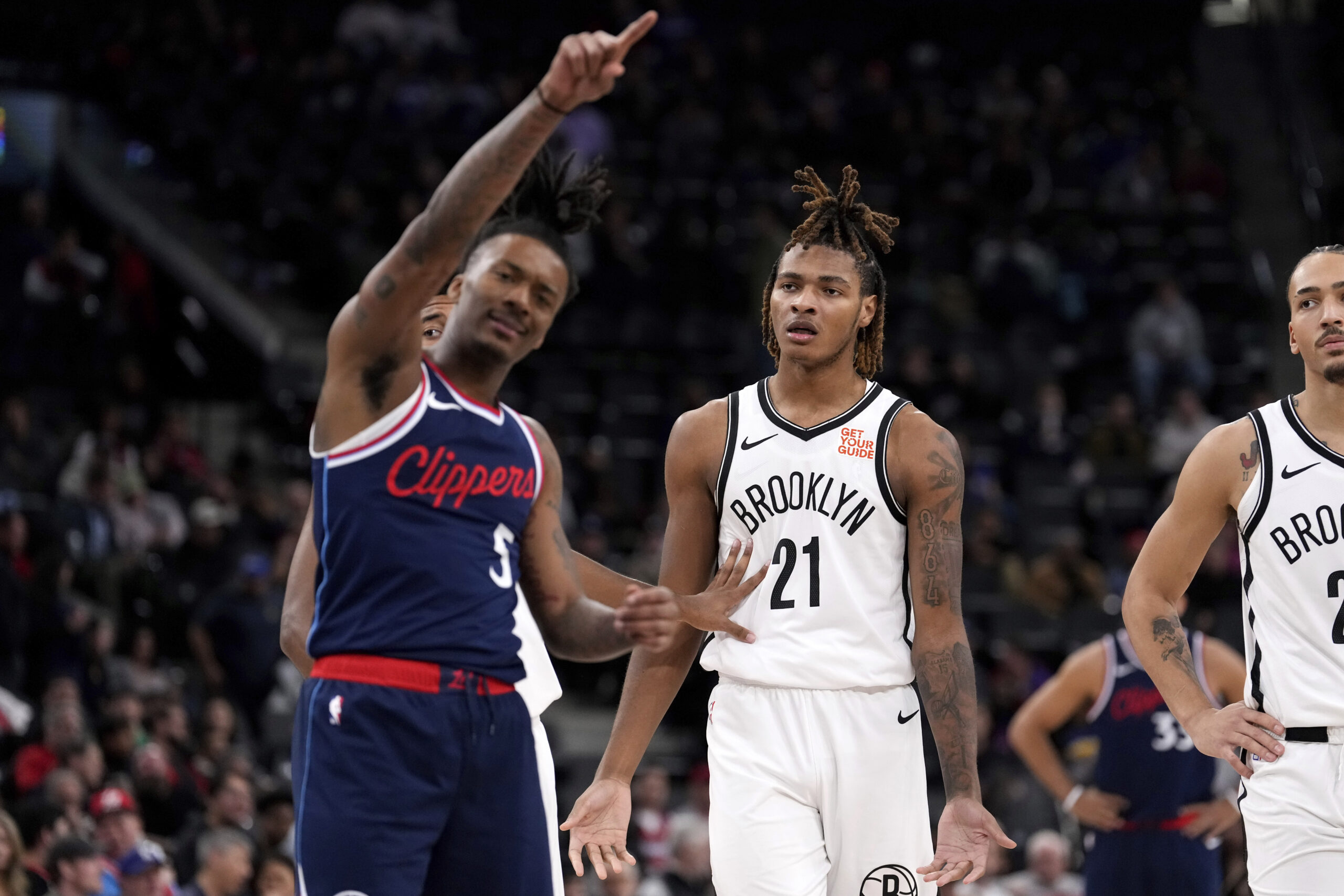 Brooklyn Nets forward Noah Clowney, center, reacts after being ejected...