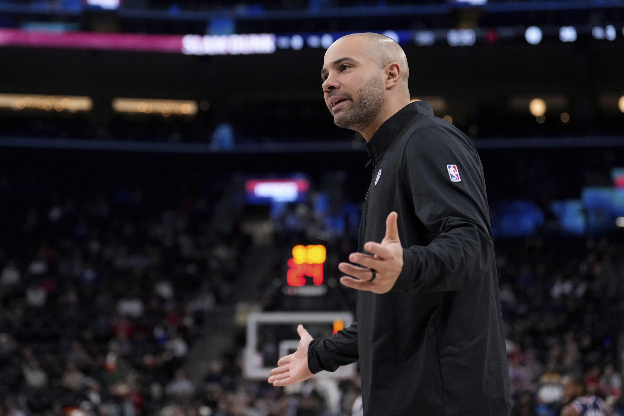 Brooklyn Nets head coach Jordi Fernández Torres gestures to referees...