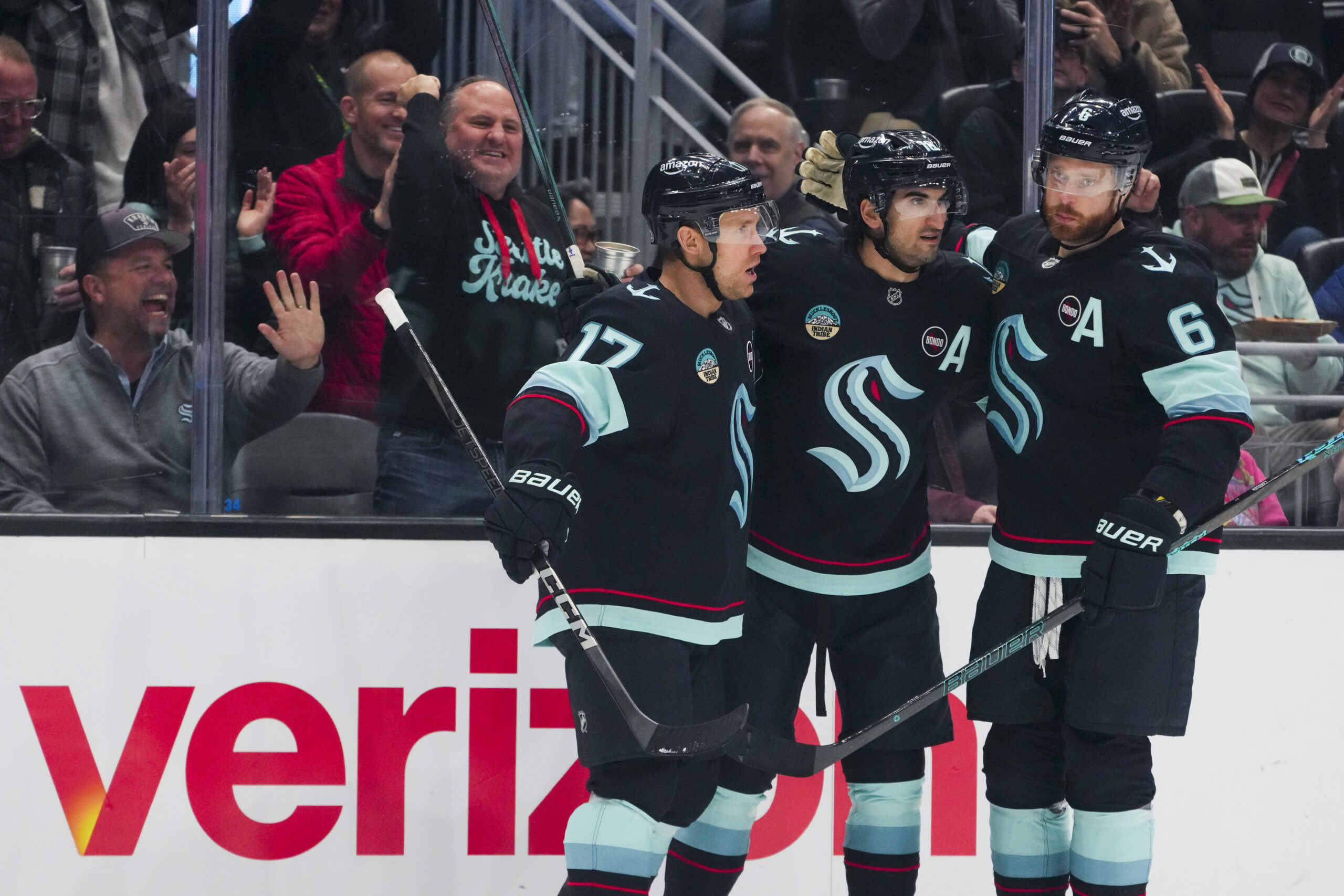 Seattle Kraken center Jaden Schwartz, left, celebrates his goal with...